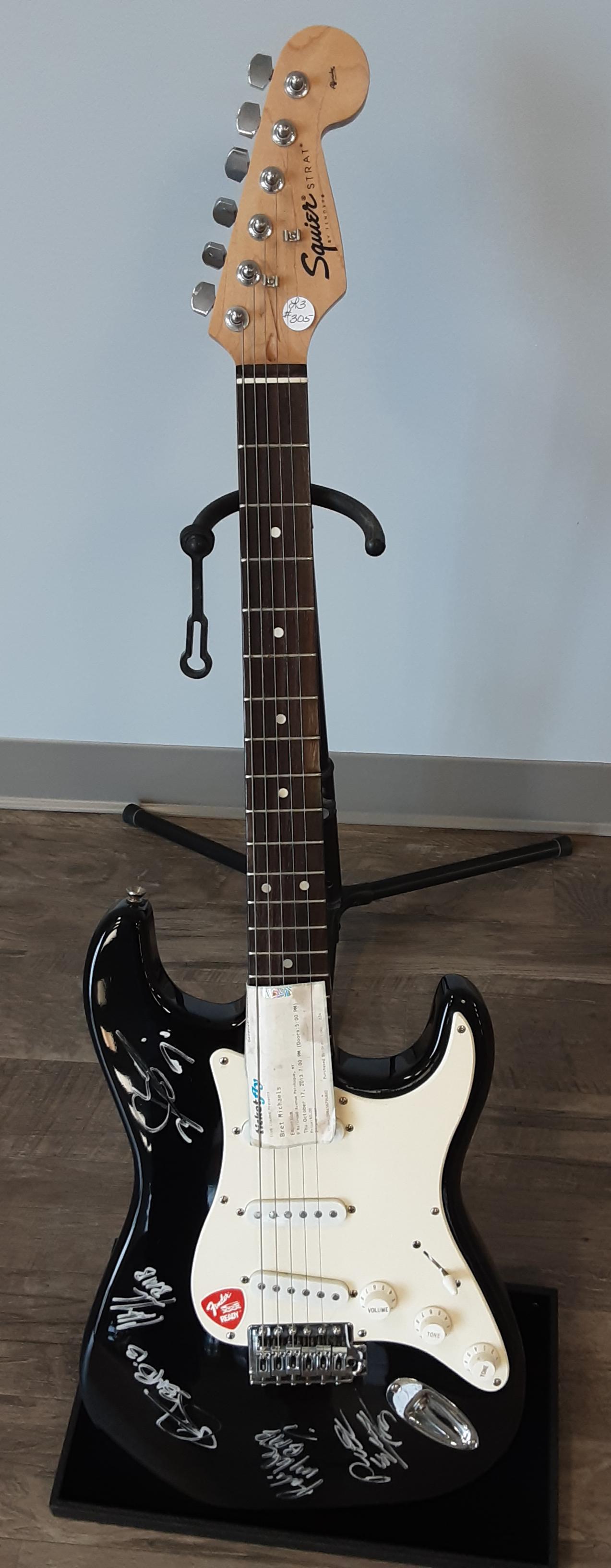 Electric guitar, autographed by Bret Michaels and his: Fantastic Fender Squier Stratocaster model, electric guitar. Hand signed and autographed by Bret Michaels and his band. Sold along with the concert ticket where it was autographed. A great addition to
