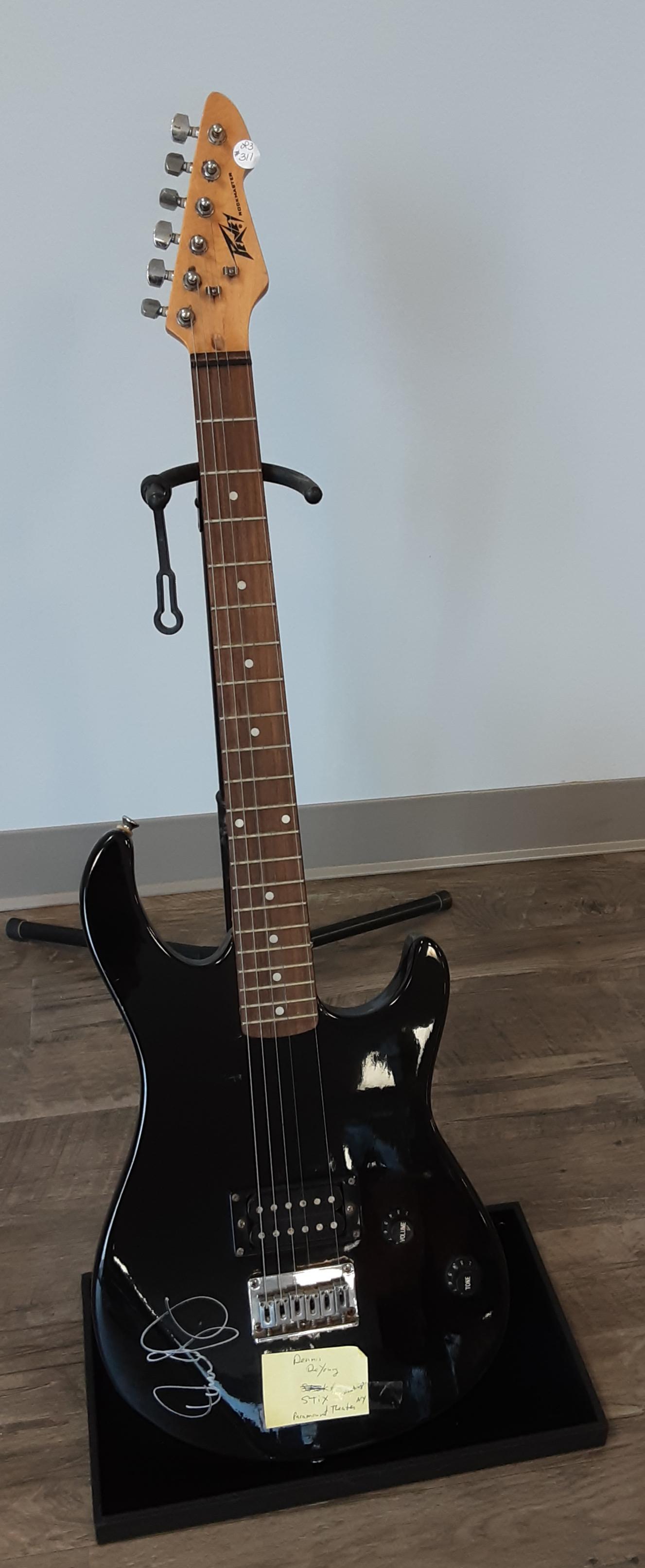 Electric guitar, autographed by Dennis DeYoung of Stix: Rare, vintage black peavey Rockmaster electric guitar. Hand signed and autographed by Dennis DeYoung of Stix rock and roll band.