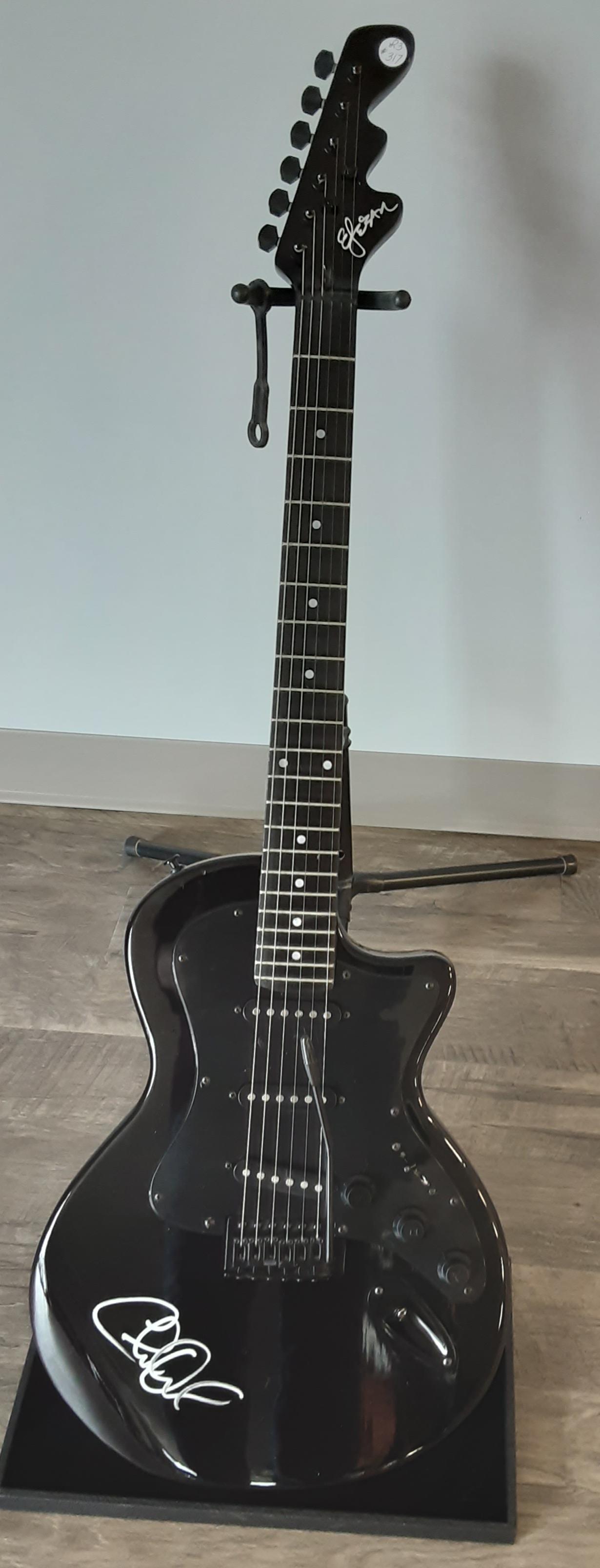 Guitar by Easteban, autographed by Charlie Daniels: Beautiful black Les Paul jr style guitar by Easteban. Hand signed and autographed by Charlie Daniels. A true legend in American history.
