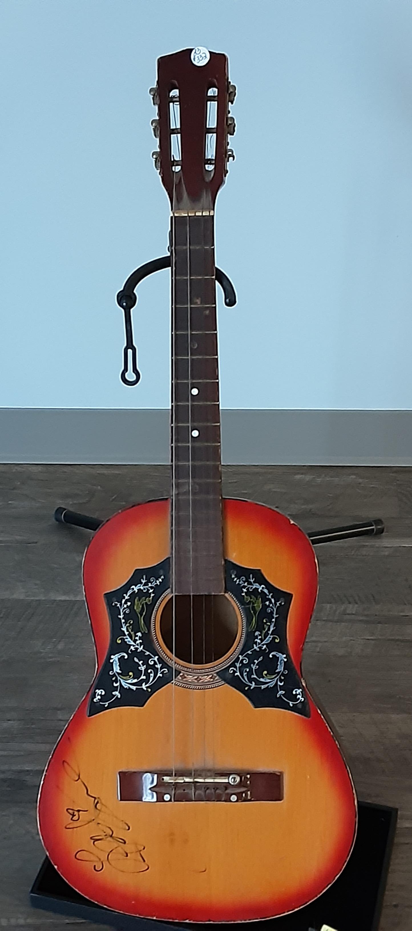 Classic acoustic guitar, autographed by LeAnn Rimes: Classic acoustic guitar, hand signed and autographed by LeAnn Rimes, singer, songwriter and actress.