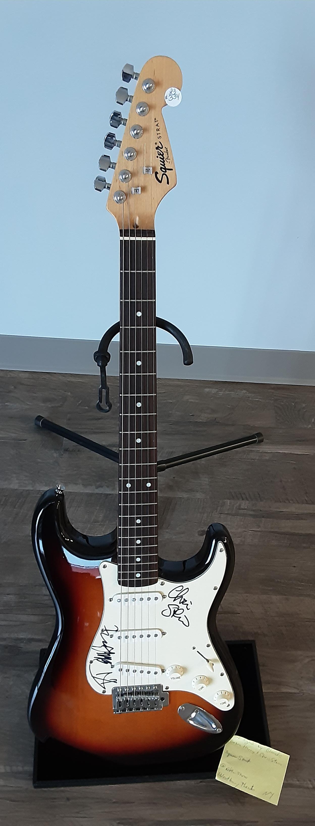 Guitar, autographed by the band, Blondie, Debbie Harry: Fender Strat square sunburst electric guitar. In beautiful condition. Hand signed and autographed by the rock and roll band, Blondie, Debbie Harry and Chris Stein.
