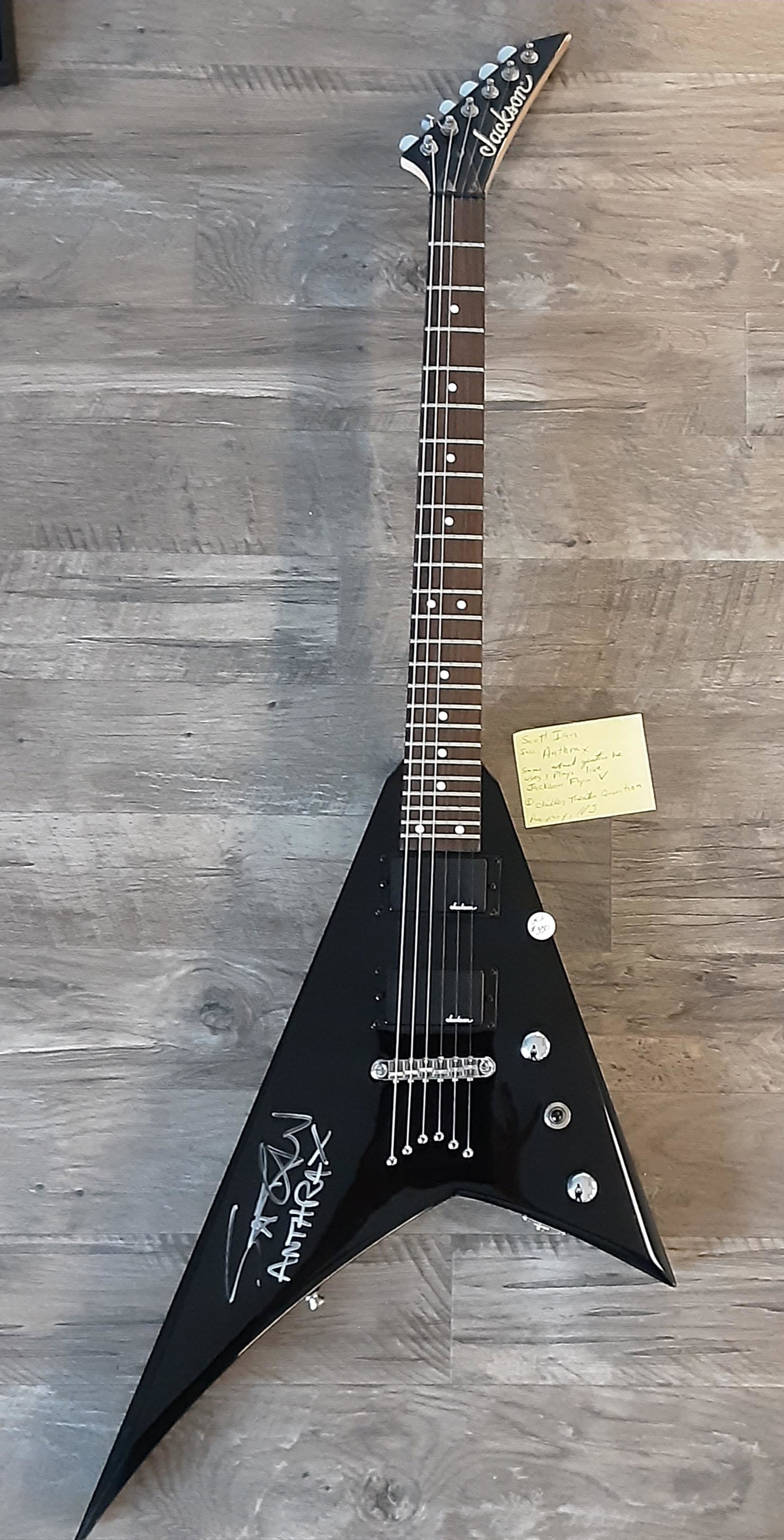 Guitar by Jackson, autographed by Scott Ian: Rare, flying V guitar by Jackson. Hand signed and autographed by Scott Ian, singer and songwriter for the heavy metal rock band anthrax, storm trooper, etc. Sold with case.