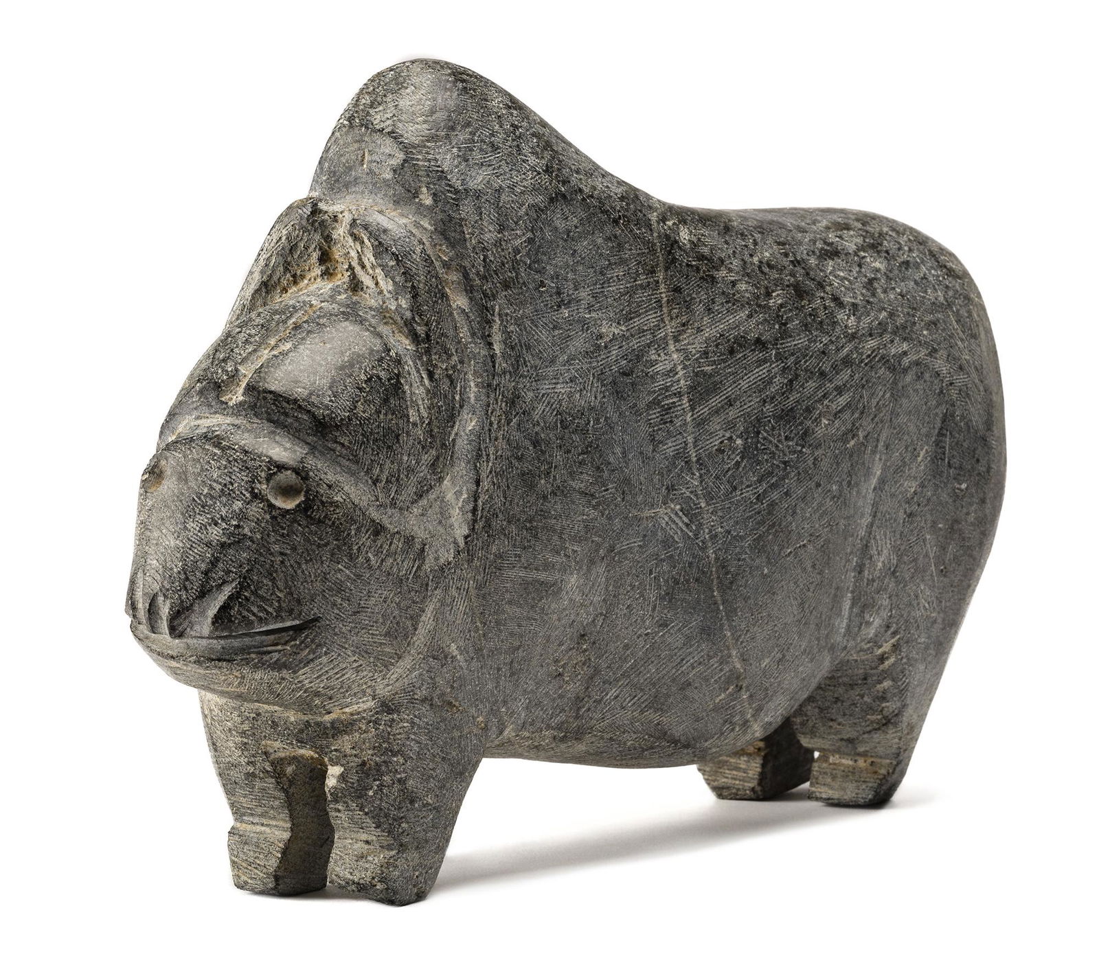 JOHN KAVIK, Muskox, c. 1974-75: JOHN KAVIK (1897-1993), KANGIQLINIQ (RANKIN INLET) Muskox, c. 1974-75 stone, 8.75 x 13.25 x 3.5 in (22.2 x 33.7 x 8.9 cm) unsigned.