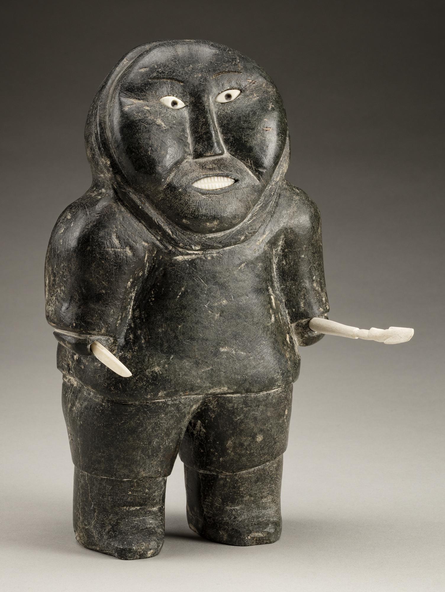 Attr: JOHNNY INUKPUK, Standing Hunter, c. 1952-53: Attibuted to JOHNNY INUKPUK, R.C.A (1911-2007), INUKJUAK (PORT HARRISON) Standing Hunter with Spear and Knife, c. 1952-53 stone, antler