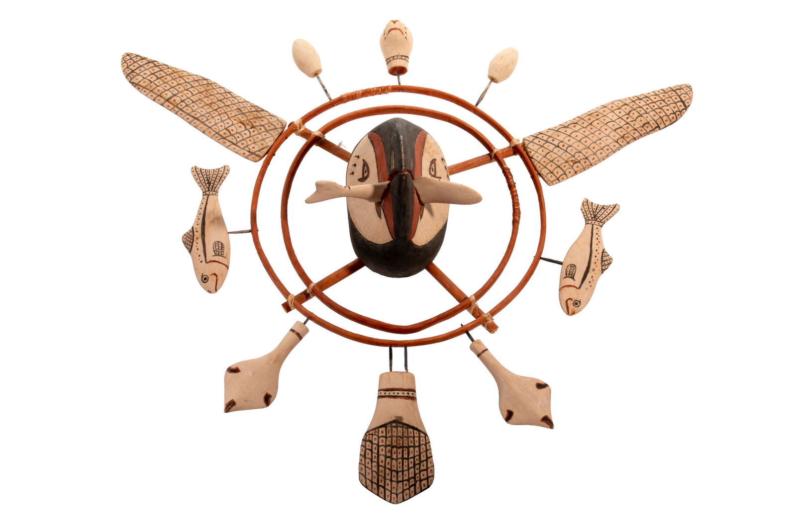 LARRY FLOAT SR., Inua Puffin Mask: LARRY FLOAT SR. (1935-2001) MEKORYUK, ALASKA Inua Puffin Mask wood mask representing a puffin with caught fish in its beak, framed by two red painted bentwood rings, attaching loose pegged p