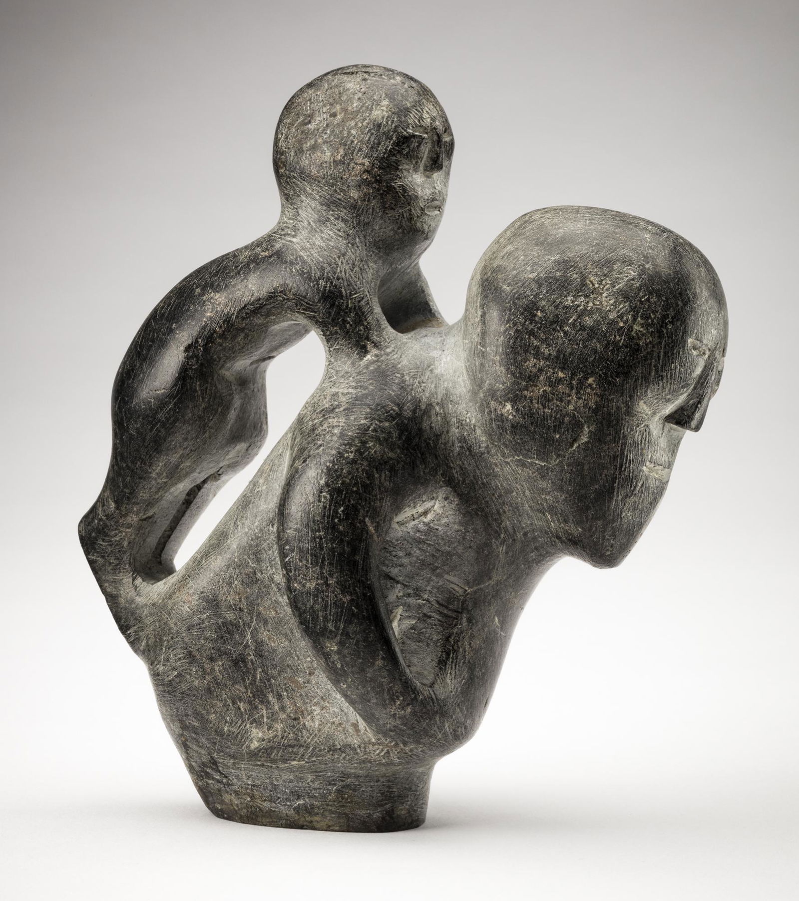JOHN TIKTAK, Inuit, Mother and Child, 1965: JOHN TIKTAK, R.C.A. (1916-1981) KANGIQLINIQ (RANKIN INLET) Mother and Child,1965 stone, 6 x 4.75 x 2.75 in (15.2 x 12.1 x 7 cm) unsigned; inscribed with a museum registration number [?] in an unknown