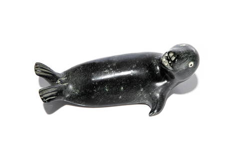 JUDAS ULLULAQ, Inuit, Seal Looking Back, mid-late 1980s: JUDAS ULLULAQ (1937-1999) UQSUQTUUQ (GJOA HAVEN) Seal Looking Back, mid-late 1980s stone and antler 3.25 x 7.25 x 3.5 in (8.3 x 18.4 x 8.9 cm) signed, "ᐅᓗᓚ". Provenance Private Colle