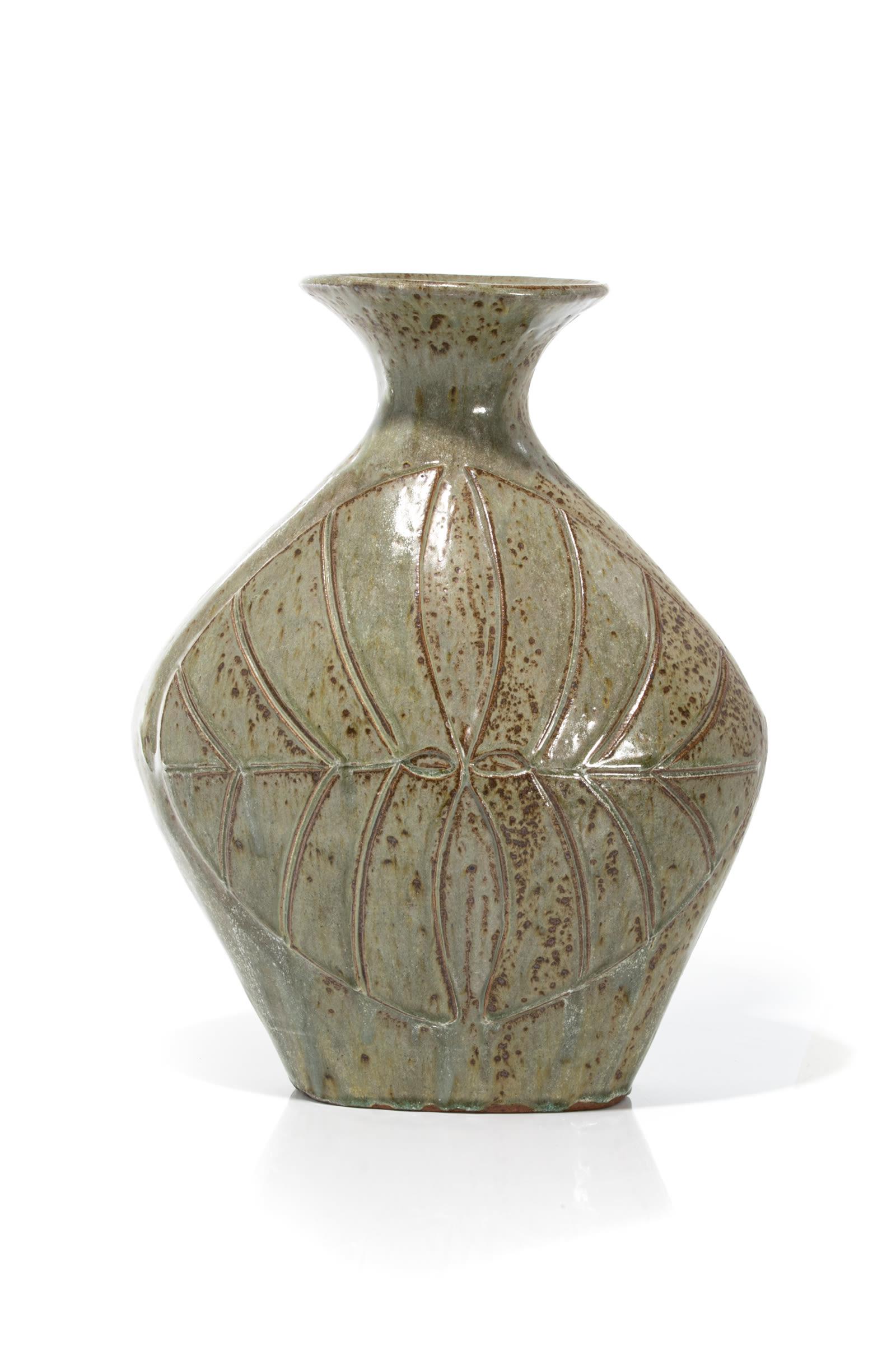 YVOO SAMGUSAK MANGELIK, INUIT, Vase, May 1975: YVOO SAMGUSAK MANGELIK (1942-2013) KANGIQLINIQ (RANKIN INLET) Vase Decorated to Either Side with Winged Motif, May 1975 glazed ceramic, 17 x 13 x 7.5 in (43.2 x 33 x 19.1 cm) signed, "ᓴᒍ&#