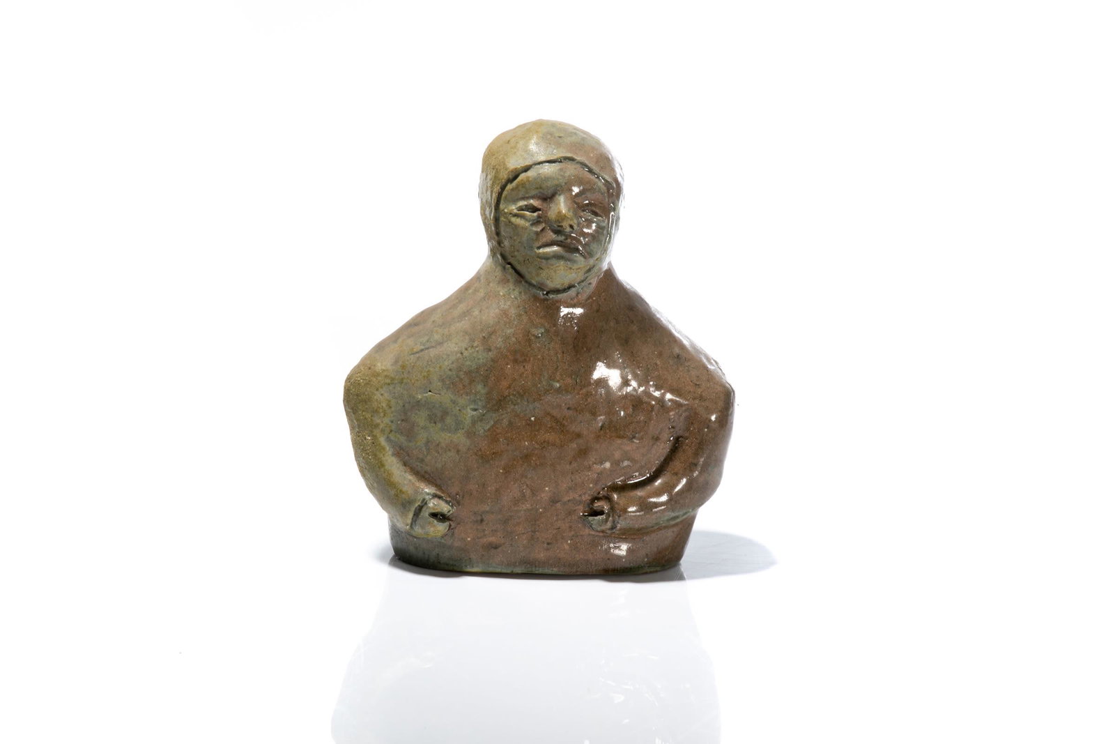 ELI TIKEAYAK, INUIT, Half-Length Bust of an Inuk, c.: ELI TIKEAYAK (1933-1995) KANGIQLINIQ (RANKIN INLET) Half-Length Bust of an Inuk, c. early 1970s glazed ceramic, 6.5 x 5.5 x 3 in (16.5 x 14 x 7.6 cm) signed, "ᑎᑭᐊᔭ". Provenance