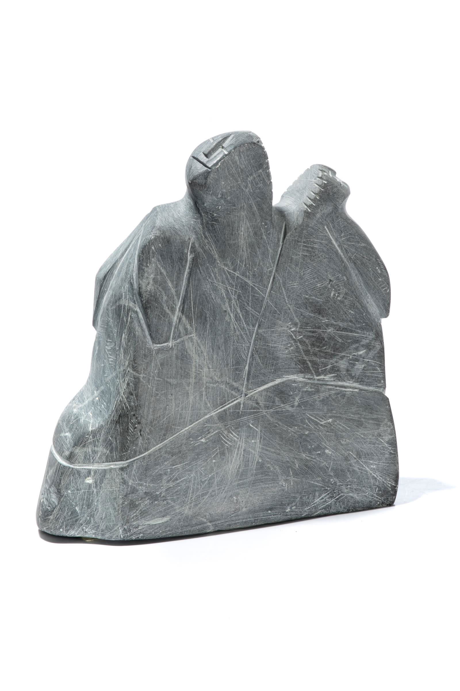 LUCY TASSEOR TUTSWEETOK, INUIT, Mother and Child, late: LUCY TASSEOR TUTSWEETOK (1934-2012) ARVIAT (ESKIMO POINT) Mother with Child in her Amaut, late 1980s stone, 8 x 7.25 x 3 in (20.3 x 18.4 x 7.6 cm) signed, "ᓗᓯ". Provenance A Toronto Col