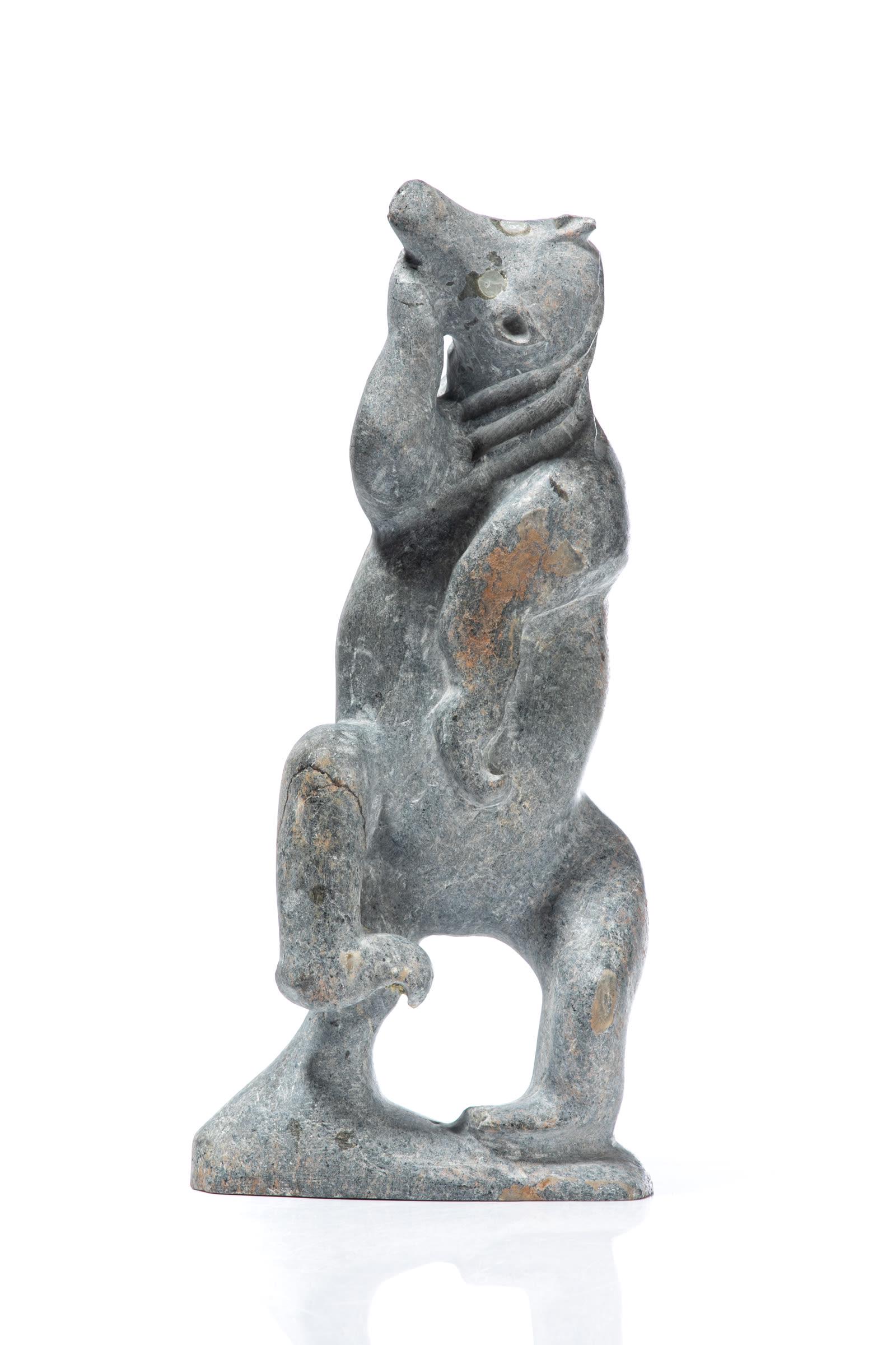 SILAS AITTAUQ, INUIT, Polar Bear Spirit, c. 1980s: SILAS AITTAUQ (1933-2013) QAMANI’TUAQ (BAKER LAKE) Polar Bear Spirit, c. 1980s stone, 9.5 x 4.5 x 2.5 in (24.1 x 11.4 x 6.3 cm) signed, "ᐄᑕᐅ". Provenance A Toronto Collectio