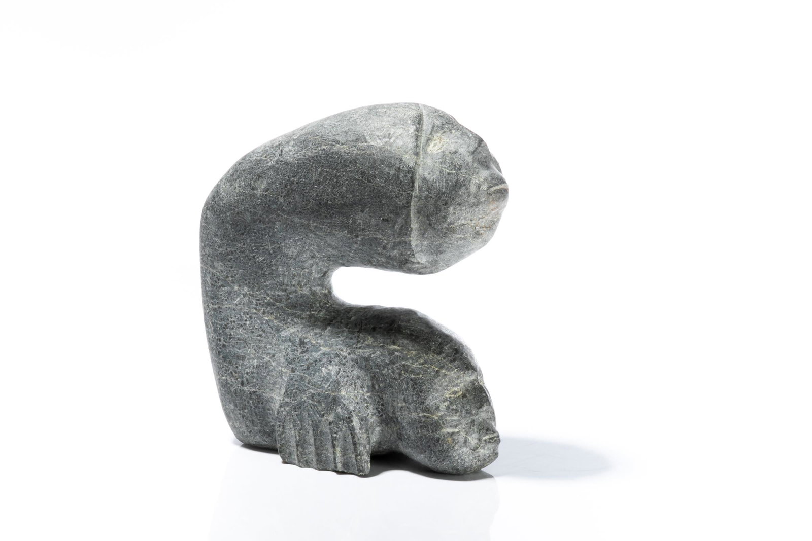 PETER SEVOGA, INUIT, Shaman / Fish Transformation, 1999: PETER SEVOGA (1940-2007) QAMANI’TUAQ (BAKER LAKE) Shaman / Fish Transformation, 1999 stone, 6.75 x 2.5 x 6 in (17.1 x 6.3 x 15.2 cm) signed, "ᐱᑕ / ᓱᕙᒐ"; dated "1999