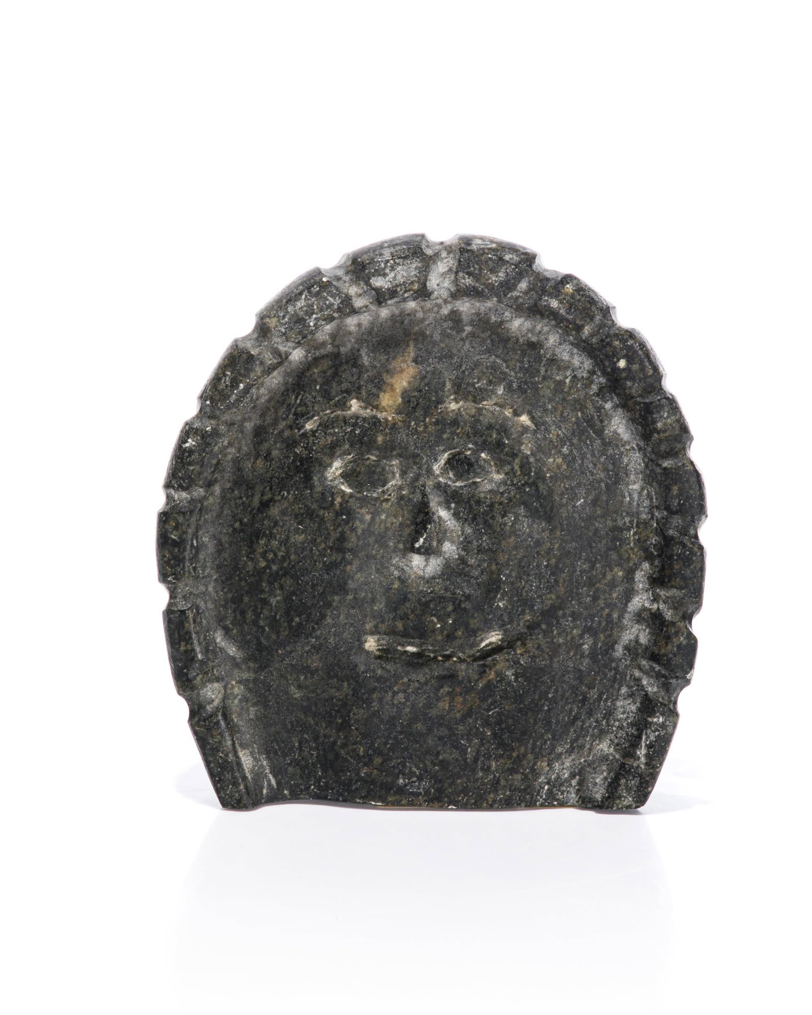 LUCY TIKIQ TUNGUAK, INUIT, Head of a Hooded Woman, c.: LUCY TIKIQ TUNGUAK (1939-) QAMANI’TUAQ (BAKER LAKE) Head of a Hooded Woman, c. 1990s stone, 5 x 4.75 x 1.75 in (12.7 x 12.1 x 4.4 cm) unsigned. Provenance A Toronto Collection.