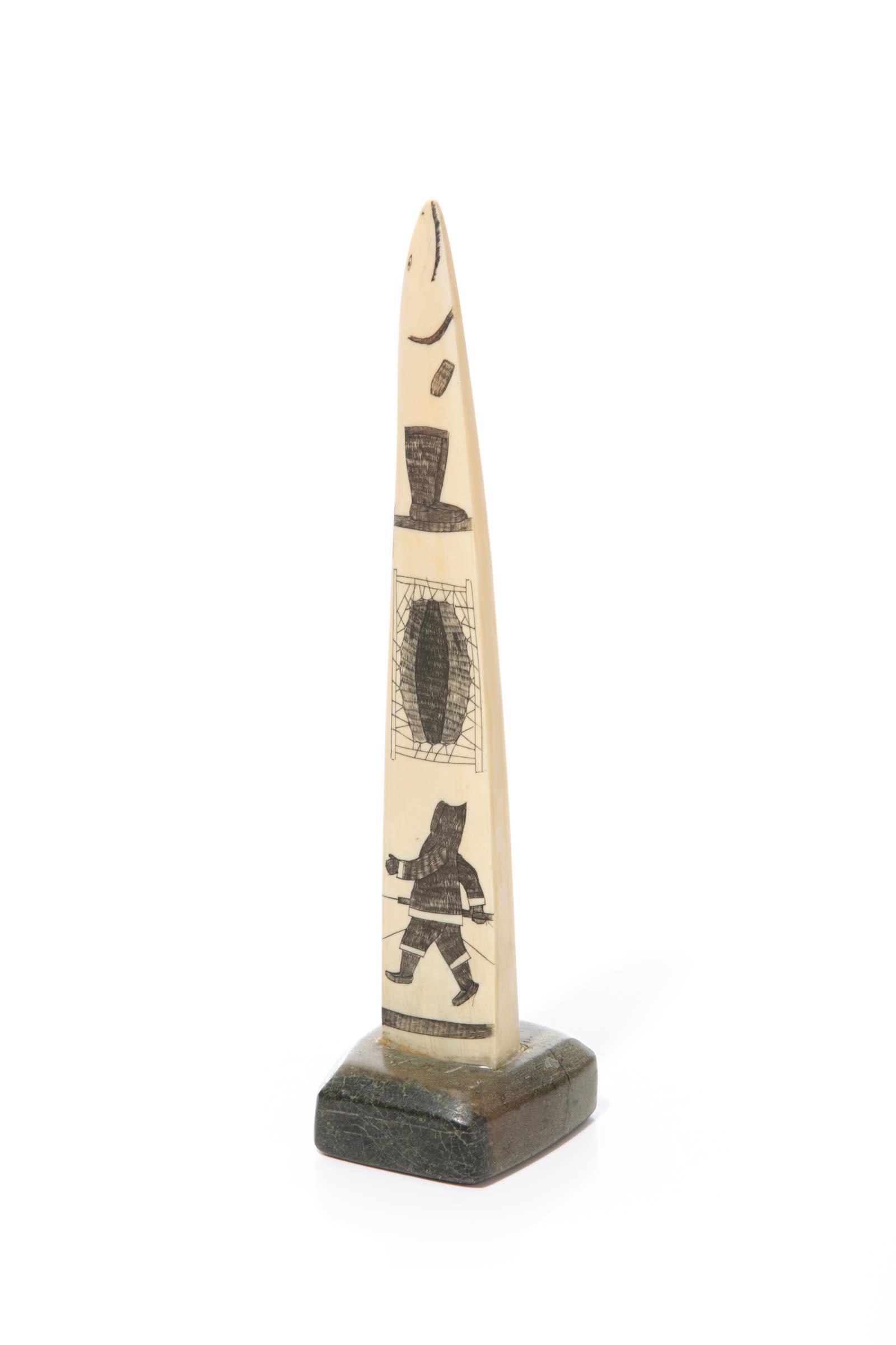 UNIDENTIFIED INUIT ARTIST, Incised Tusk with Arctic: UNIDENTIFIED ARTIST, KINNGAIT (CAPE DORSET) or KIMMIRUT (LAKE HARBOUR) Incised Tusk with Arctic Motifs, 1970s walrus tusk, stone, and ink, 12 x 3 x 3 in (30.5 x 7.6 x 7.6 cm) unsigned. Provenance A