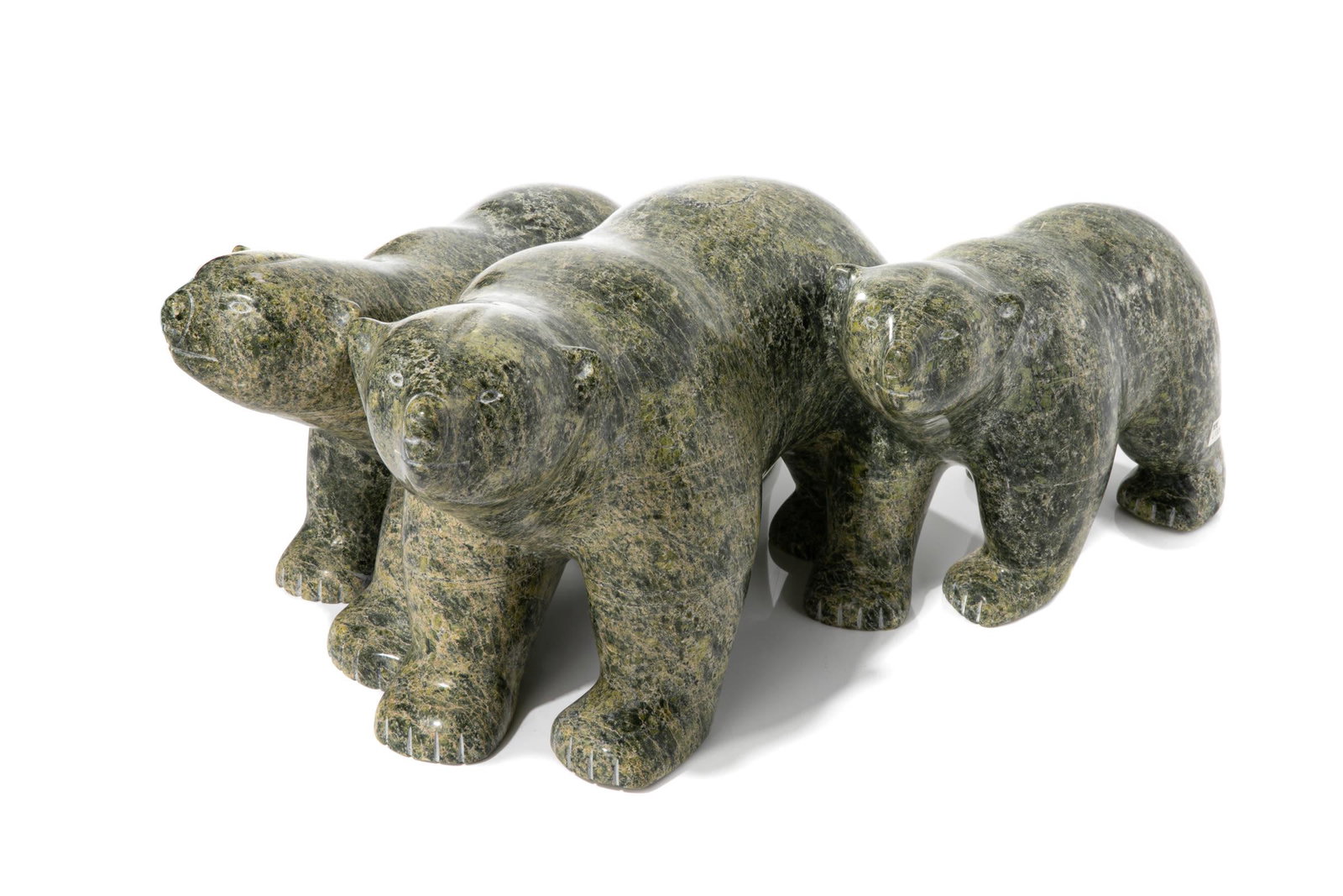 TAQIALUQ NUNA, INUIT, Family of Bears: TAQIALUQ NUNA (1958-) KINNGAIT (CAPE DORSET) Family of Bears stone, 8.5 x 19 x 13 in (21.6 x 48.3 x 33 cm) unsigned. Provenance Private Collection, Ottawa. Taqialuq learned how to carve by fi