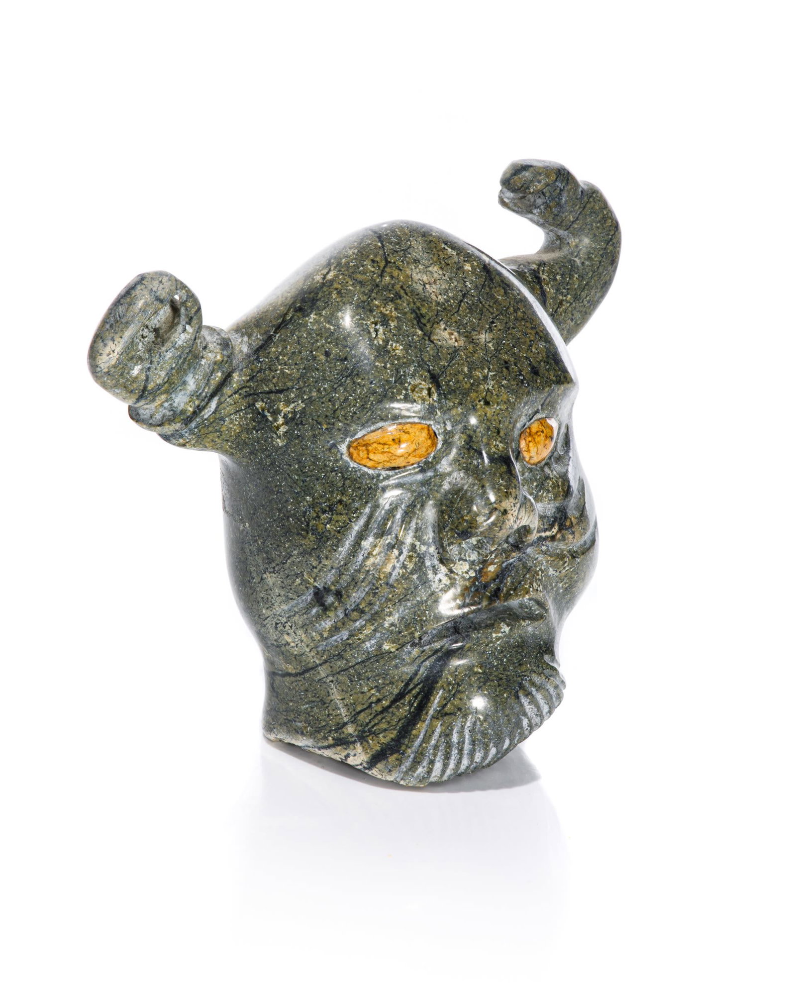 GIDEON QAUQJUAQ, INUIT, Shaman, c. 1990s: GIDEON QAUQJUAQ (1941-) TALOYOAK (SPENCE BAY) Shaman, c. 1990s stone with inlaid stone eyes, 4.5 x 5 x 2.75 in (11.4 x 12.7 x 7 cm) signed, "QAUQJUAQ / ᑲᐅᔭᐊ". Provenance A T