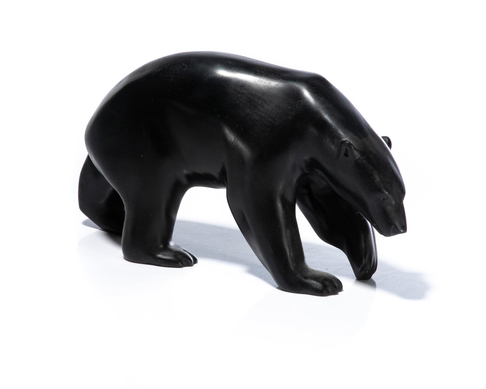 BILL NASOGALUAK, INUIT, Stalking Polar Bear, 2009: BILL NASOGALUAK (1953-) TUKTOYAKTUK Stalking Polar Bear, 2009 stone, 4 x 2.5 x 7.25 in (10.2 x 6.3 x 18.4 cm) signed and dated, "BILL / NASOGALUAK / 2009". Provenance A Toronto Collection.