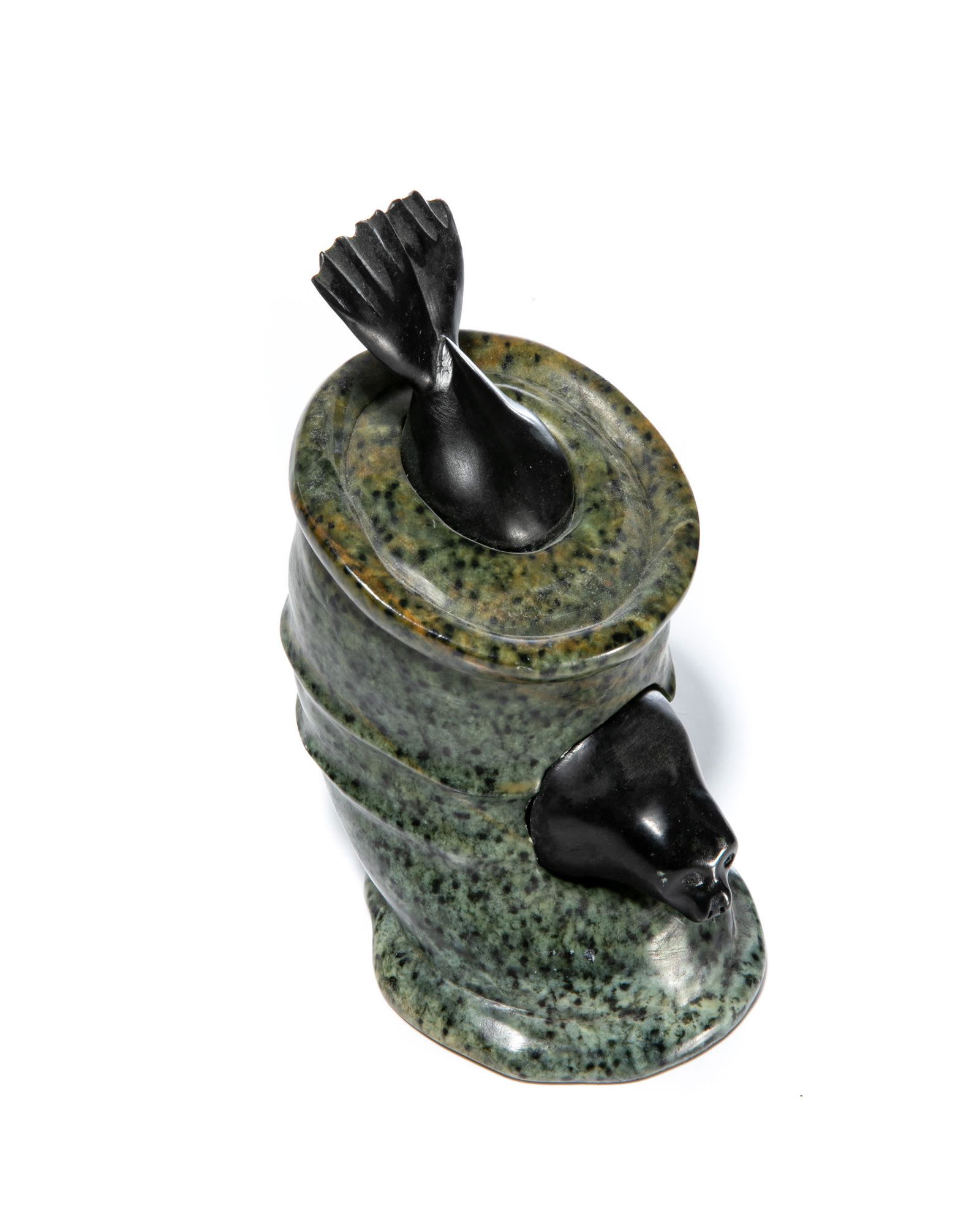 BILL NASOGALUAK, INUIT, Seal Stuck in Oil Drum, 2012: BILL NASOGALUAK (1953-) TUKTOYAKTUK Seal Stuck in Oil Drum, 2012 stone, 7.75 x 4 x 5.5 in (19.7 x 10.2 x 14 cm) signed and dated, "BILL NASOGALUAK / 2012" Provenance A Toronto Collection. Th