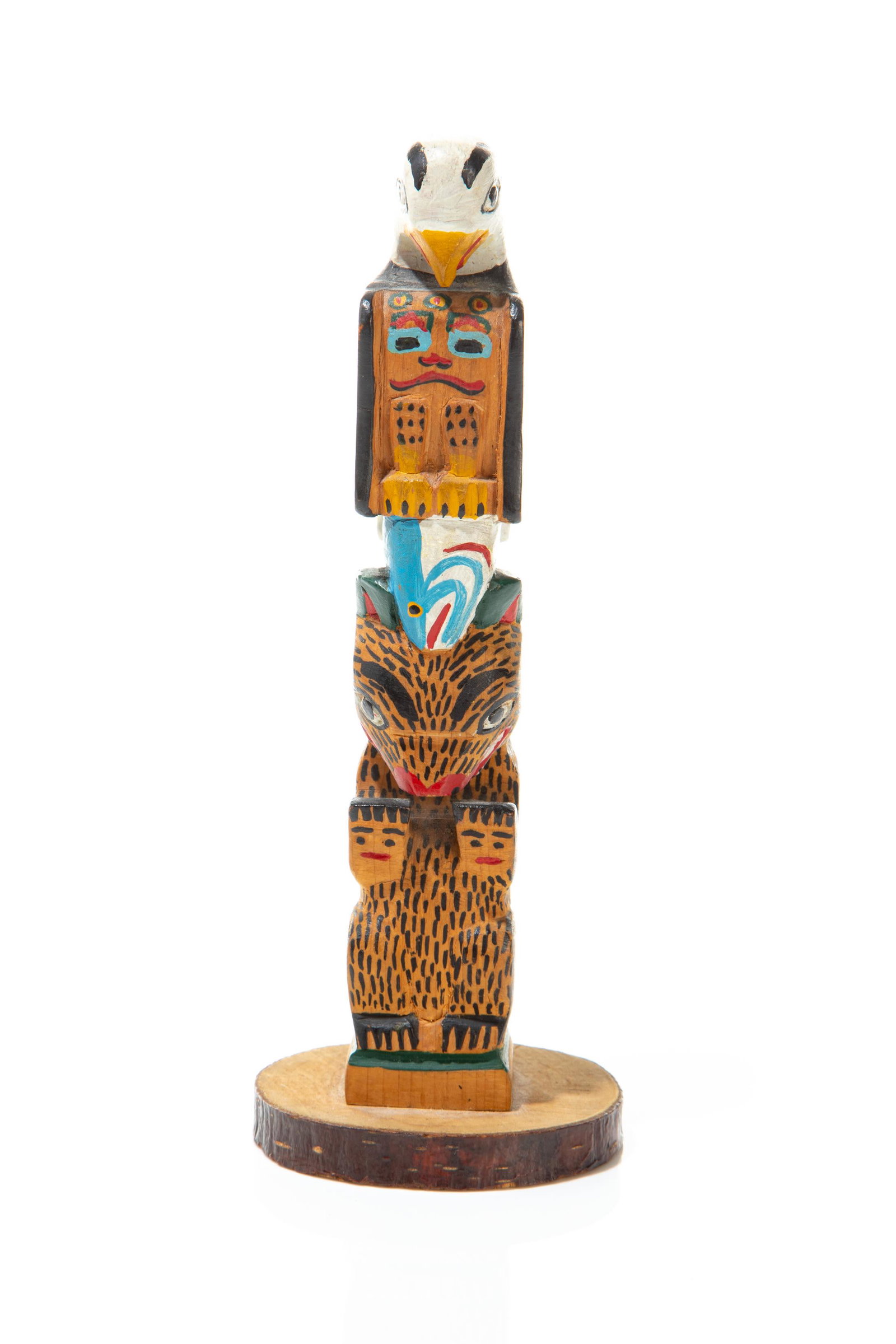 ELI TAIT, FIRST NATIONS, Model Totem, c. 1920-1940: ELI TAIT, TLINGIT Model Totem, c. 1920-1940 carved and polychromed, 7.25 x 2.5 x 2.25 in (18.4 x 6.3 x 5.7 cm) carved in a stacked arrangement with an eagle clutching a salmon atop a a seated bear; si