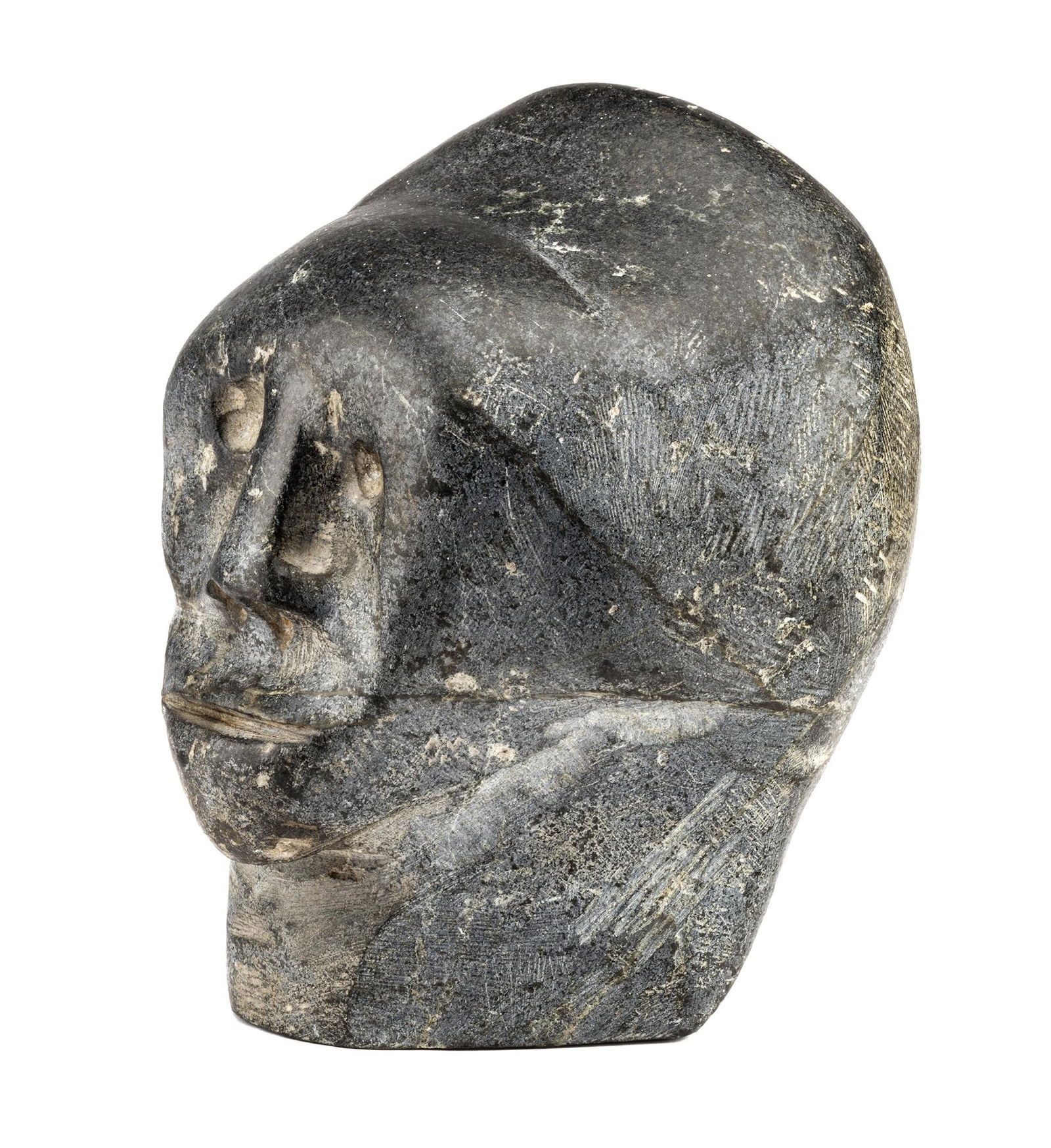 JOHN KAVIK, INUIT, Head, 1976: JOHN KAVIK (1897-1993) KANGIQLINIQ (RANKIN INLET) Head, 1976 stone, 6 x 6 x 4.5 in (15.2 x 15.2 x 11.4 cm) given to the artist and dated, "John Kavik / 1976". ESTIMATE: $2,500 — $3,500