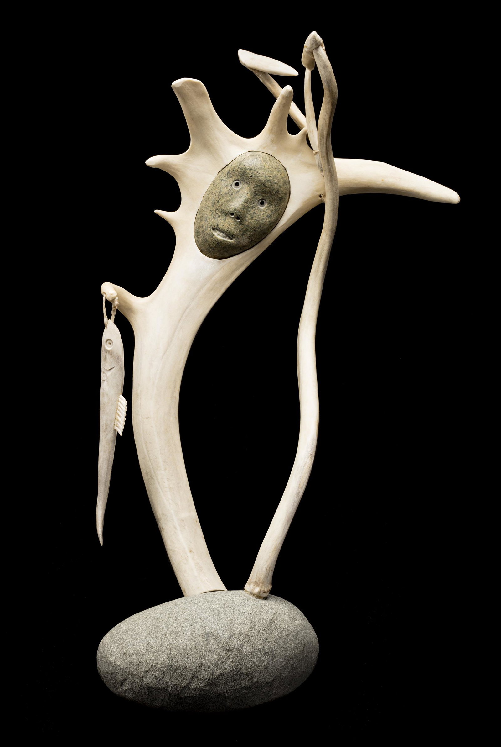 MATTIUSI IYAITUK, INUIT, I Got My First Fish, 2006: MATTIUSI IYAITUK (1950-) IVUJIVIK I Got My First Fish, 2006 antler, waxed string, and stone, 21 x 12 x 7.25 in (53.3 x 30.5 x 18.4 cm) titled, dated, and signed, "I got my / first fish / á’ªá‘�