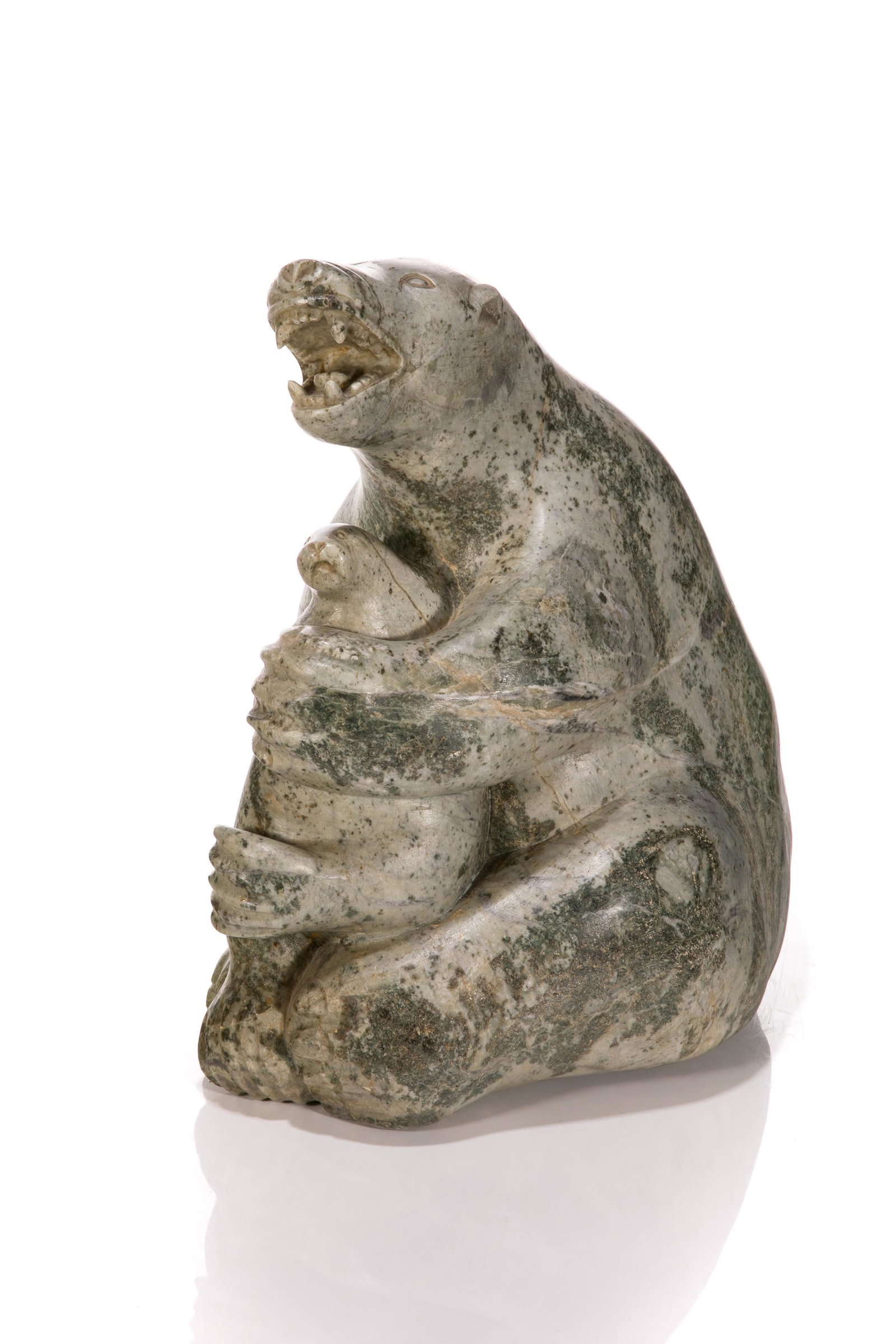 QAQAQ (KAKA) ASHOONA, INUIT, Polar Bear with Captured Seal, c. 1970s: QAQAQ (KAKA) ASHOONA (1928-1996) KINNGAIT (CAPE DORSET) Polar Bear with Captured Seal, c. 1970s stone, 14.5 x 13 x 9 in (36.8 x 33 x 22.9 cm) signed, "KAKA". Provenance Important Private Collection, C