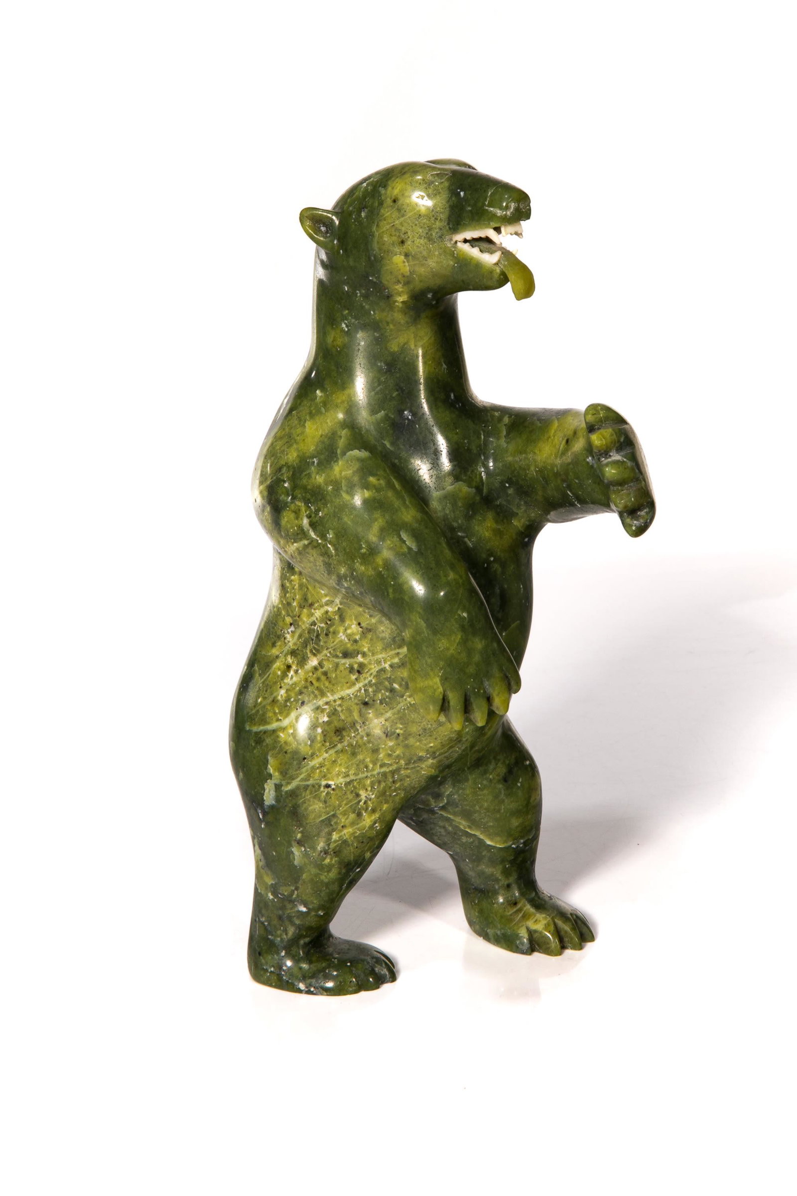 TOMMY TUKPANIE SR. INUIT, Standing Bear with Lolling Tongue, 1980s: TOMMY TUKPANIE SR. (1936-2013) KINNGAIT (CAPE DORSET) Standing Bear with Lolling Tongue, 1980s stone and antler, 8.25 x 5 x 3.25 in (21 x 12.7 x 8.3 cm) signed, "TOM / MY / ᑕᐸᓂ". Pro