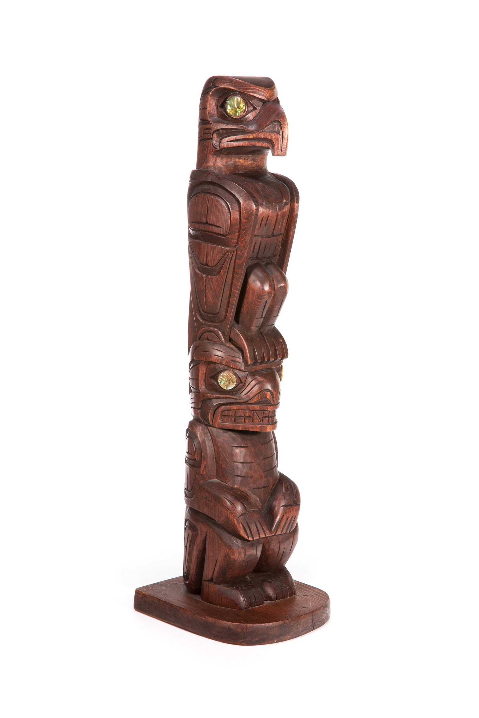 WILLIAM "WILLIE" WADHAMS, KWAKWA̱KA̱ʼWAKW, Model Totem Pole, 1998: WILLIAM "WILLIE" WADHAMS (1966-) KWAKWA̱KA̱'WAKW Model Totem Pole, 1998 carved wood and abalone, 18 x 5.5 x 5.25 in (45.7 x 14 x 13.3 cm) titled, signed, and dated, "Kwakiutle / Eagle /