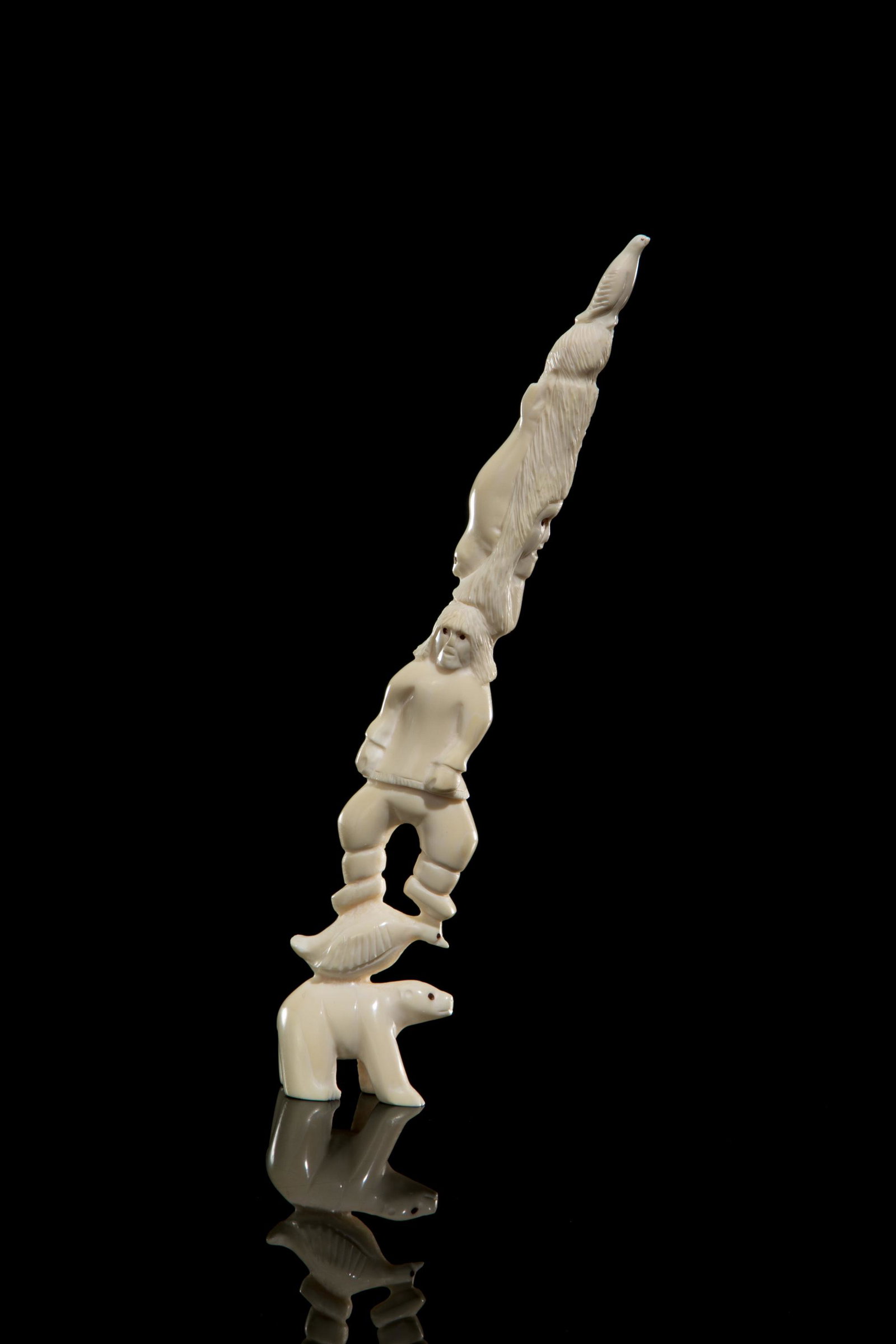 Poss.: GUYASEE VEEVEE, INUIT, Totemic Composition with Inuuk and Arctic Animals, 1990s: Possibly: GUYASEE VEEVEE (1952-) IQALUIT (FROBISHER BAY) Totemic Composition with Inuuk and Arctic Animals, 1990s walrus tusk and pigment, 10 x 2.5 x 1.25 in (25.4 x 6.3 x 3.2 cm) unsigned. Provenance