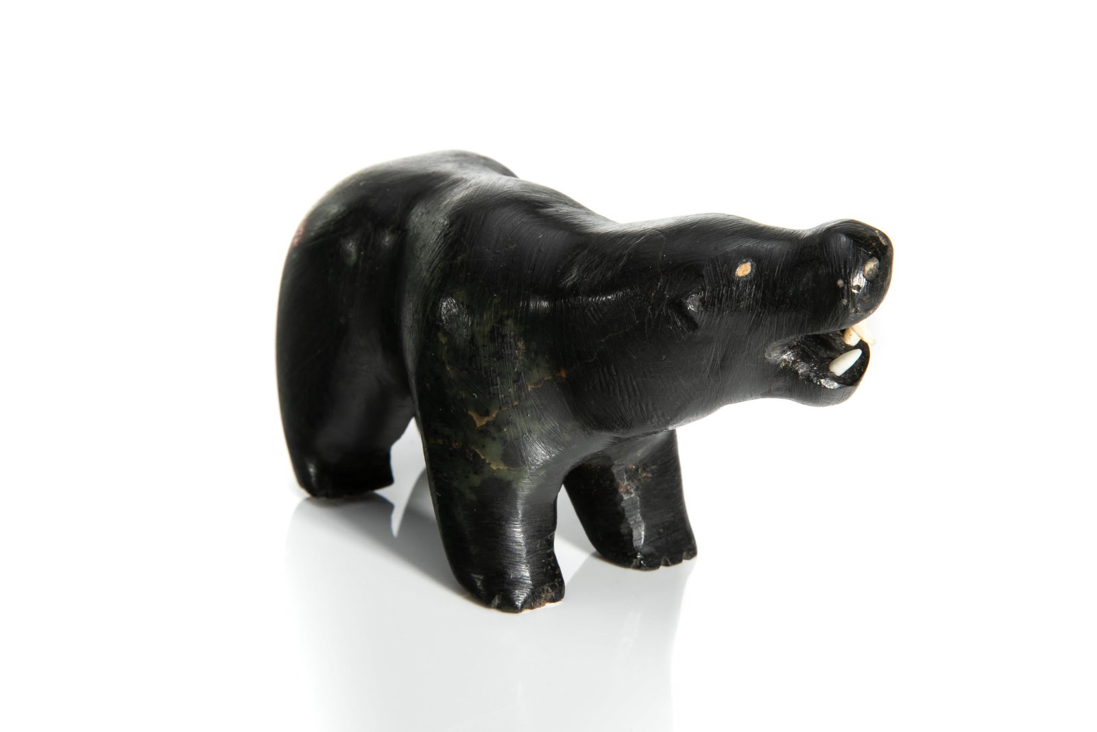 UNIDENTIFIED, INUIT, Snarling Polar Bear, late 1950s-early 1960s: UNIDENTIFIED INUIT ARTIST Snarling Polar Bear, late 1950s-early 1960s stone, tusk, and soap, 2.25 x 3.25 x 1.25 in (5.7 x 8.3 x 3.2 cm) unsigned. Provenance Private Collection, New York.