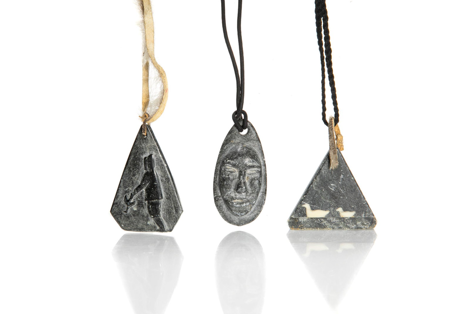 JAMASIE MIKE, MOSES AUPALUKTIK, & JOSEPHEE KILABUK, INUIT, 4Pendants, mid-late 1960s & 1968: JAMASIE MIKE (1928-) PANNIRTUQ (PANGNIRTUNG), MOSES AUPALUKTIK (1924-1983) PUVIRNITUQ (POVUNGNITUK), and JOSEPHEE KILABUK (1934-) PANNIRTUQ (PANGNIRTUNG) Three Pendants , mid-late 1960s & 1968 the fir