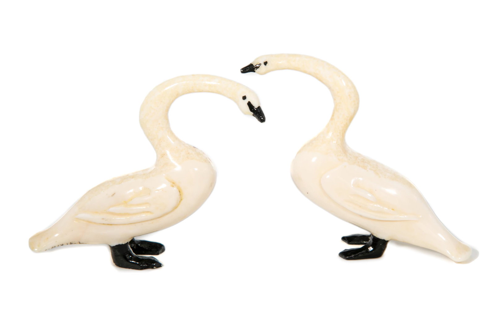 DANIEL IYAKITAN, Two Standing Geese, c. 1970: DANIEL IYAKITAN (1912-1995) GAMBELL, ALASKA, ST. LAWRENCE ISLAND Two Standing Geese, c. 1970 each tusk and black pigment, each approx: 2.75 x 1 x 3.5 in (7 x 2.5 x 8.9 cm) each signed, "DANIEL / IYAKI