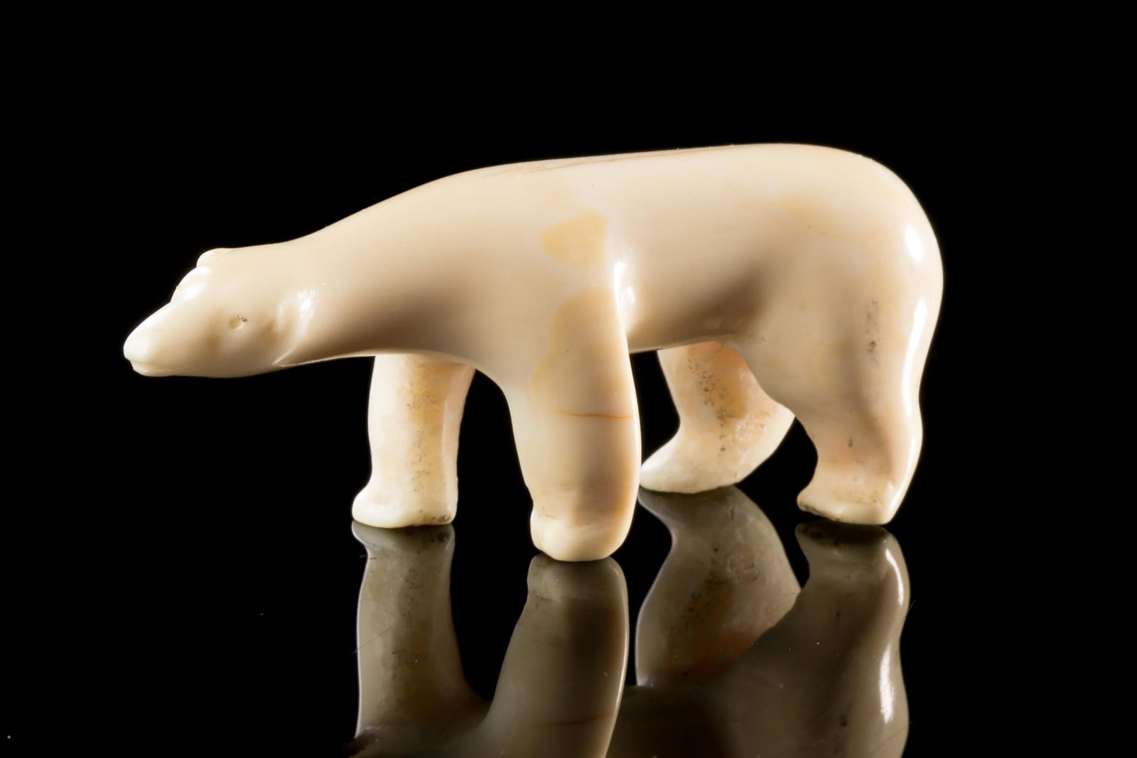 UNIDENTIFIED, INUIT, Polar Bear, 1970s: UNIDENTIFIED INUIT ARTIST Polar Bear, 1970s walrus tusk and black pigment, 1 x 2.5 x 0.75 in (2.5 x 6.3 x 1.9 cm) unsigned. Provenance Important Private Collection, Canada.