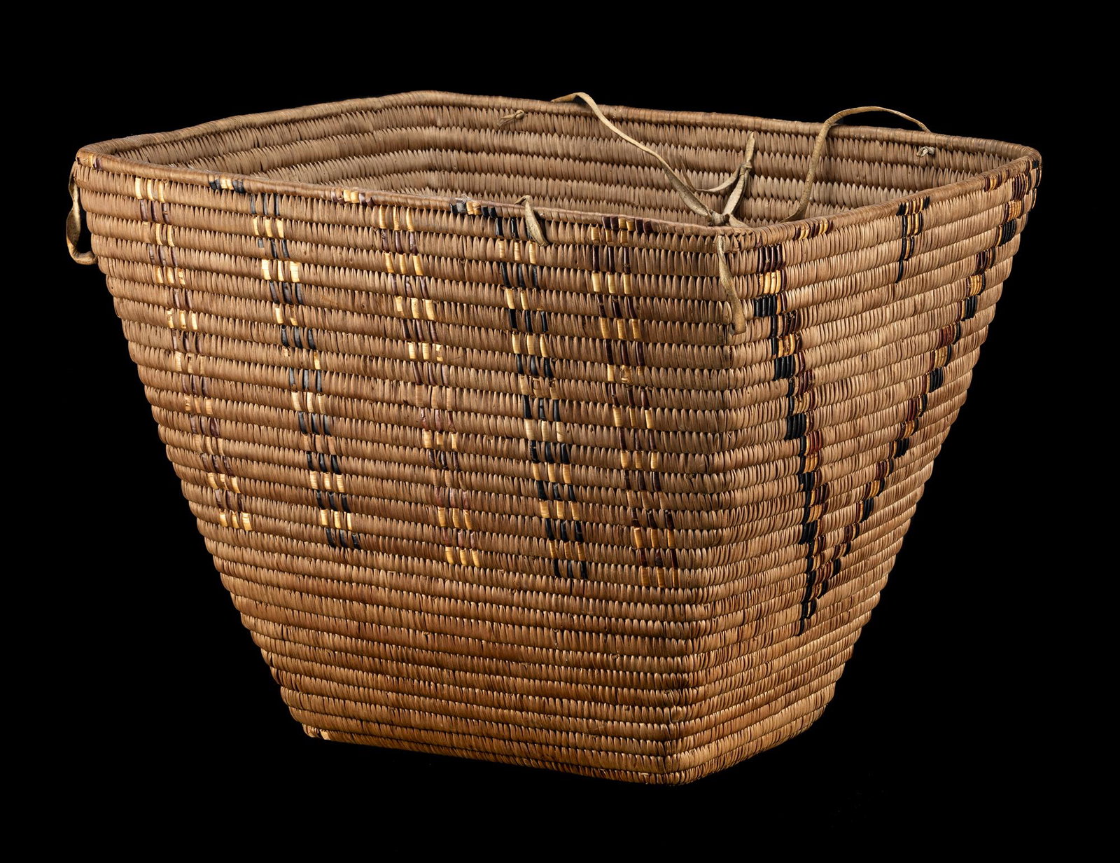 UNIDENTIFIED ARTIST, Probably INTERIOR SALISH, STL'ATL'IMX (LILLOOET), Burden Basket, c. 1900-10: UNIDENTIFIED ARTIST, PROBABLY INTERIOR SALISH, POSSIBLY STL'ATL'IMX (LILLOOET) Burden Basket, c. 1900-10 cedar root and bark, cherry bark, and hide, 13 x 17.75 x 15.25 in (33 x 45.1 x 38.7 cm) unsigne