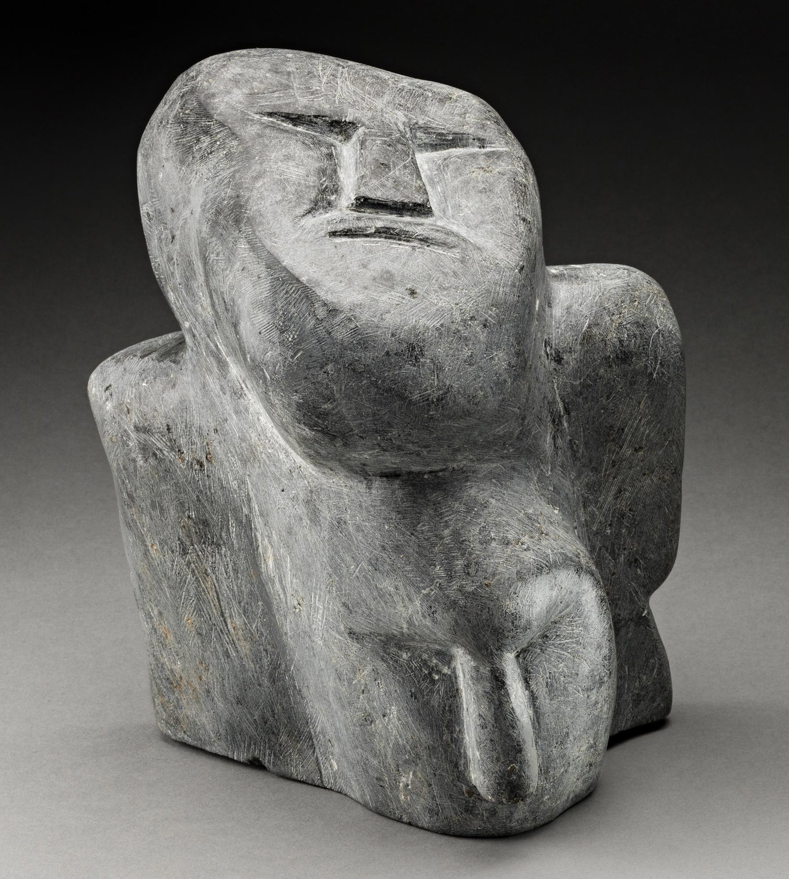 MARY MIKI, INUIT, Family Group, mid-late 1970s: MARY KAHOOTSUAK MIKI (1920-1993) ARIVAT (ESKIMO POINT) Family Group, mid-late 1970s stone, 9.75 x 8 x 6 in (24.8 x 20.3 x 15.2 cm) signed, "ᑲᓱ". Provenance A Montreal Collection. In the he