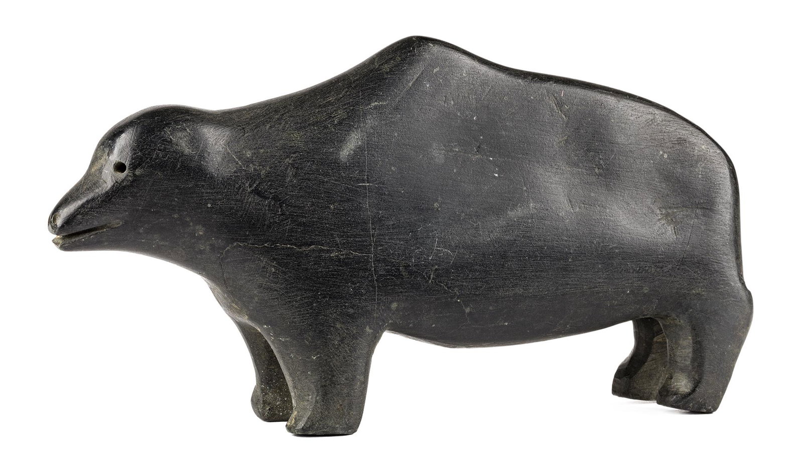 JIMMY TAIPANAK, INUIT, Bear, 1979: JIMMY TAIPANAK (1919-2000) QAMANI'TUAQ (BAKER LAKE) Bear, 1979 stone, 3.75 x 7 x 1.5 in (9.5 x 17.8 x 3.8 cm) unsigned. Provenance Private Collection, British Columbia. Jimmy Taipanak is best known fo