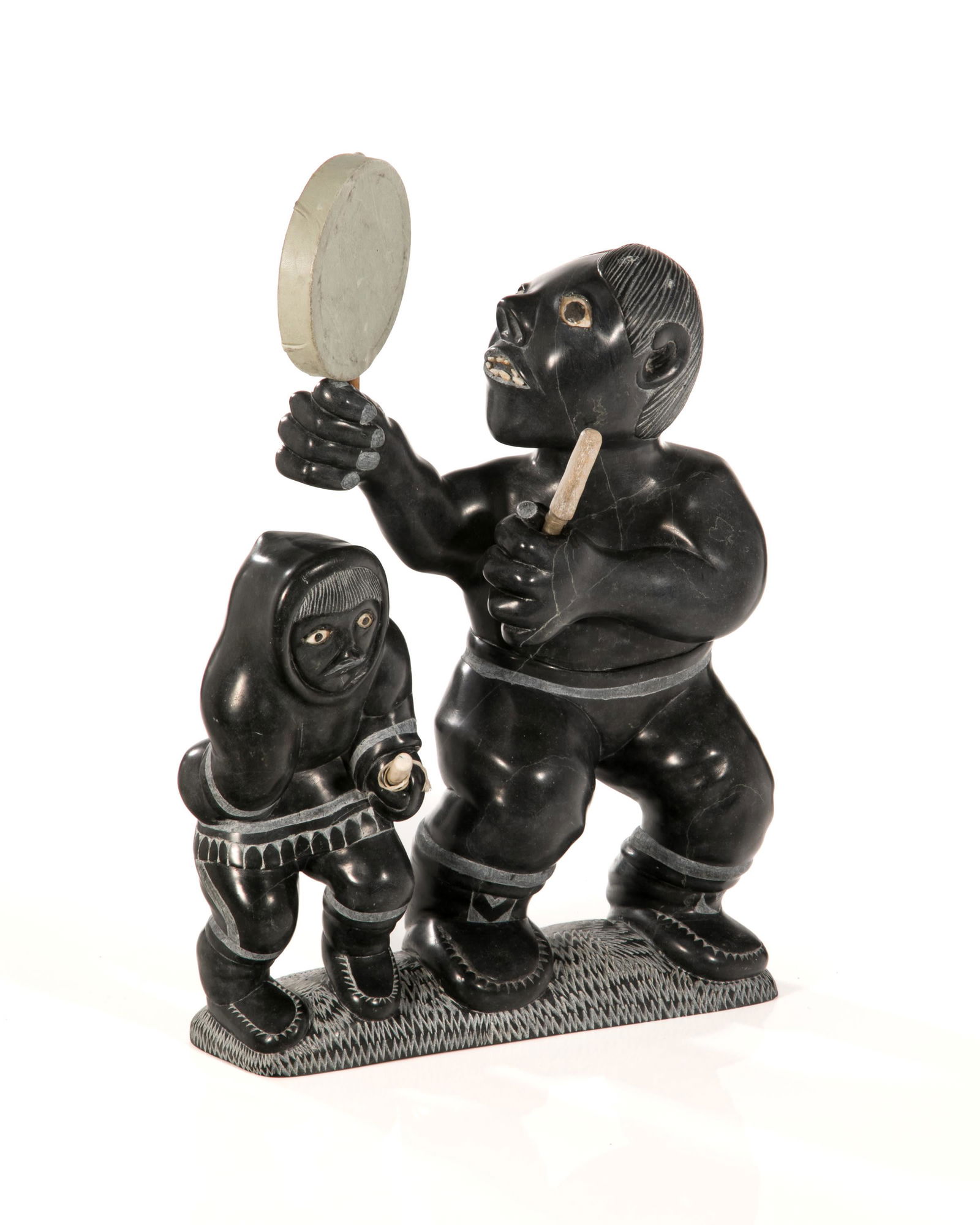 SIMEONIE ELIJASSIAPIK, INUIT, Drum Dancing Scene, 1985: SIMEONIE ELIJASSIAPIK (1948-) INUKJUAK (PORT HARRISON) Drum Dancing Scene, 1985 stone, antler, skin, and waxed string, 13 x 10 x 3.5 in (33 x 25.4 x 8.9 cm) signed and dated, "ᓯᒥᐅ