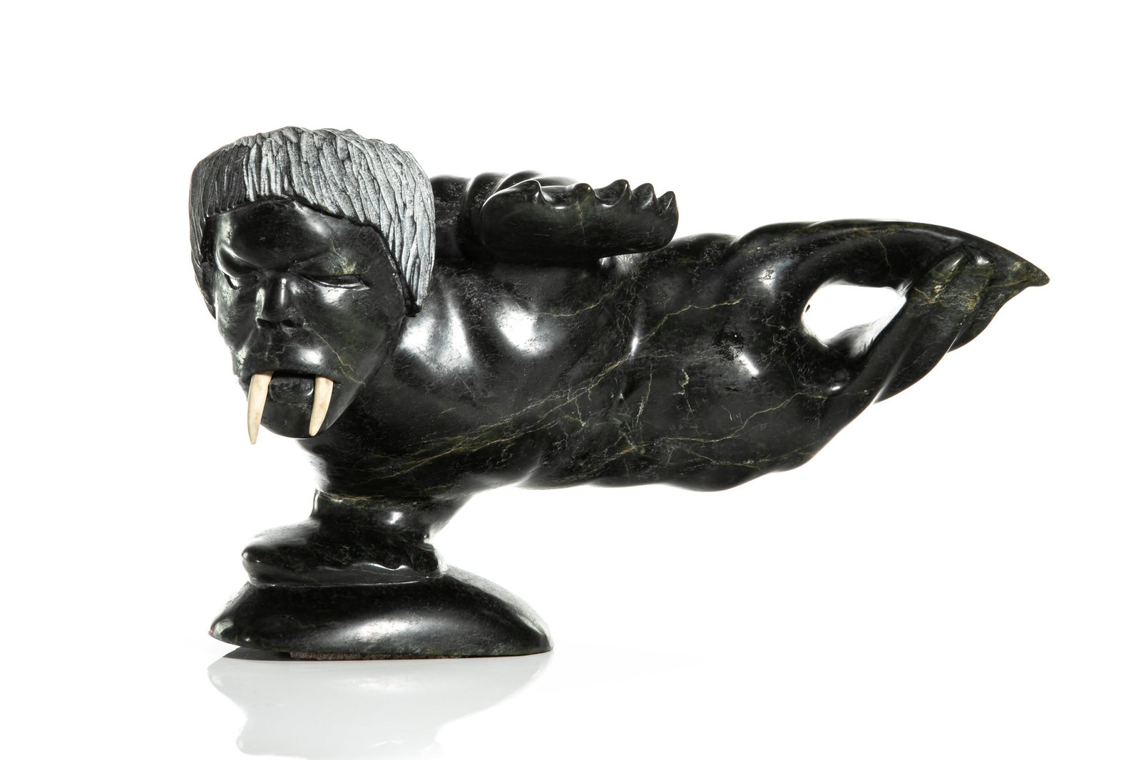 KOV TAKPAUNGAI, INUIT, Walrus Shaman, late 1980s: QUVIANATULIAK (KOV) TAKPAUNGAI (1942-) KINNGAIT (CAPE DORSET) Walrus Shaman, late 1980s stone and antler, 10.5 x 17 x 8 in (26.7 x 43.2 x 20.3 cm) signed, "ᑯᕕᐊᓇᑐᓕ&#