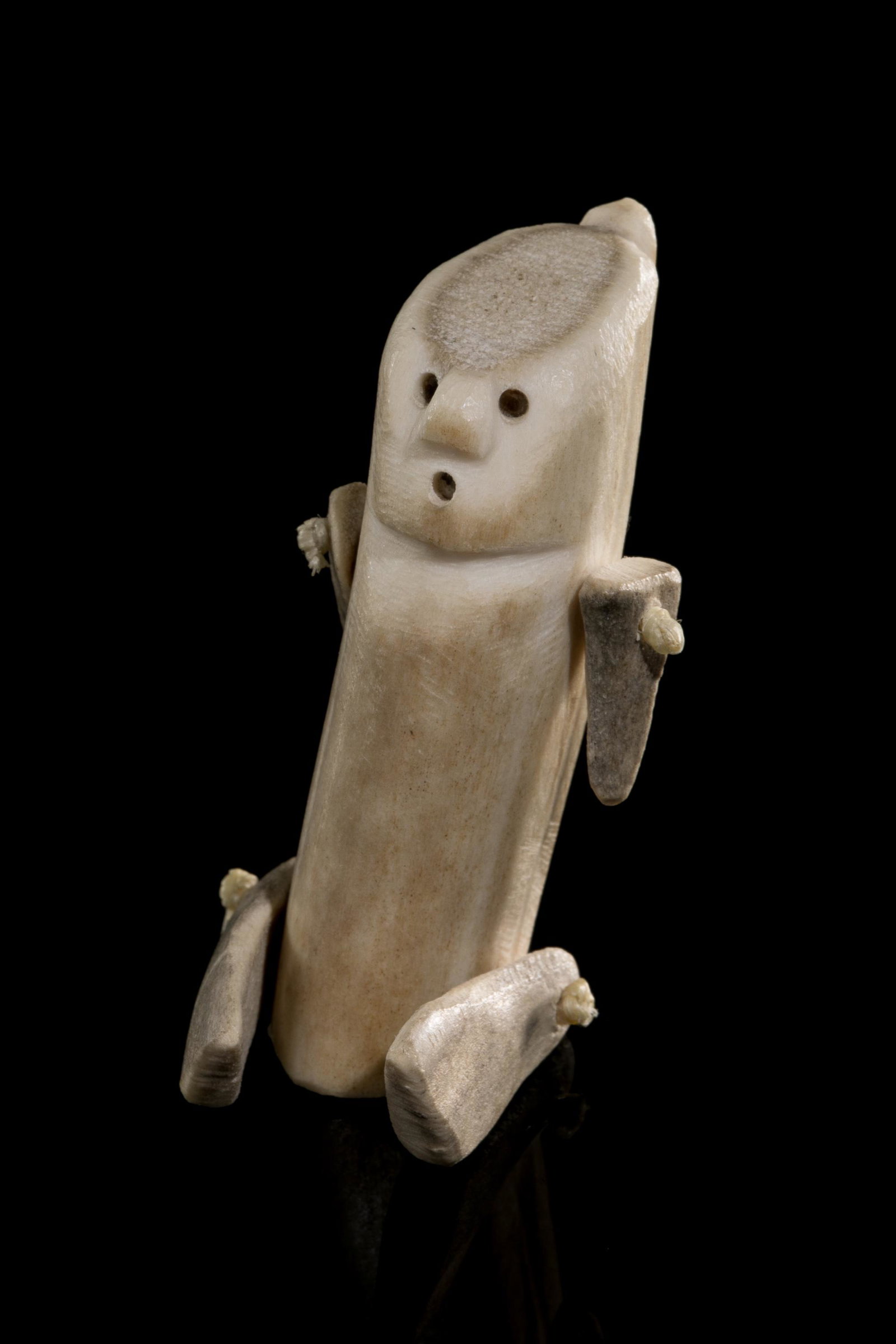 Attr: LUKE ANOWTALIK, INUIT,, Seated Inuk (Articulated Doll), mid 1970s: Attr: LUKE ANOWTALIK (1932-2006) ARVIAT (ESKIMO POINT) Seated Inuk (Articulated Doll), mid 1970s antler and waxed string, 2.25 x 1.75 x 2.5 in (5.7 x 4.4 x 6.3 cm) unsigned. Provenance Important Priva