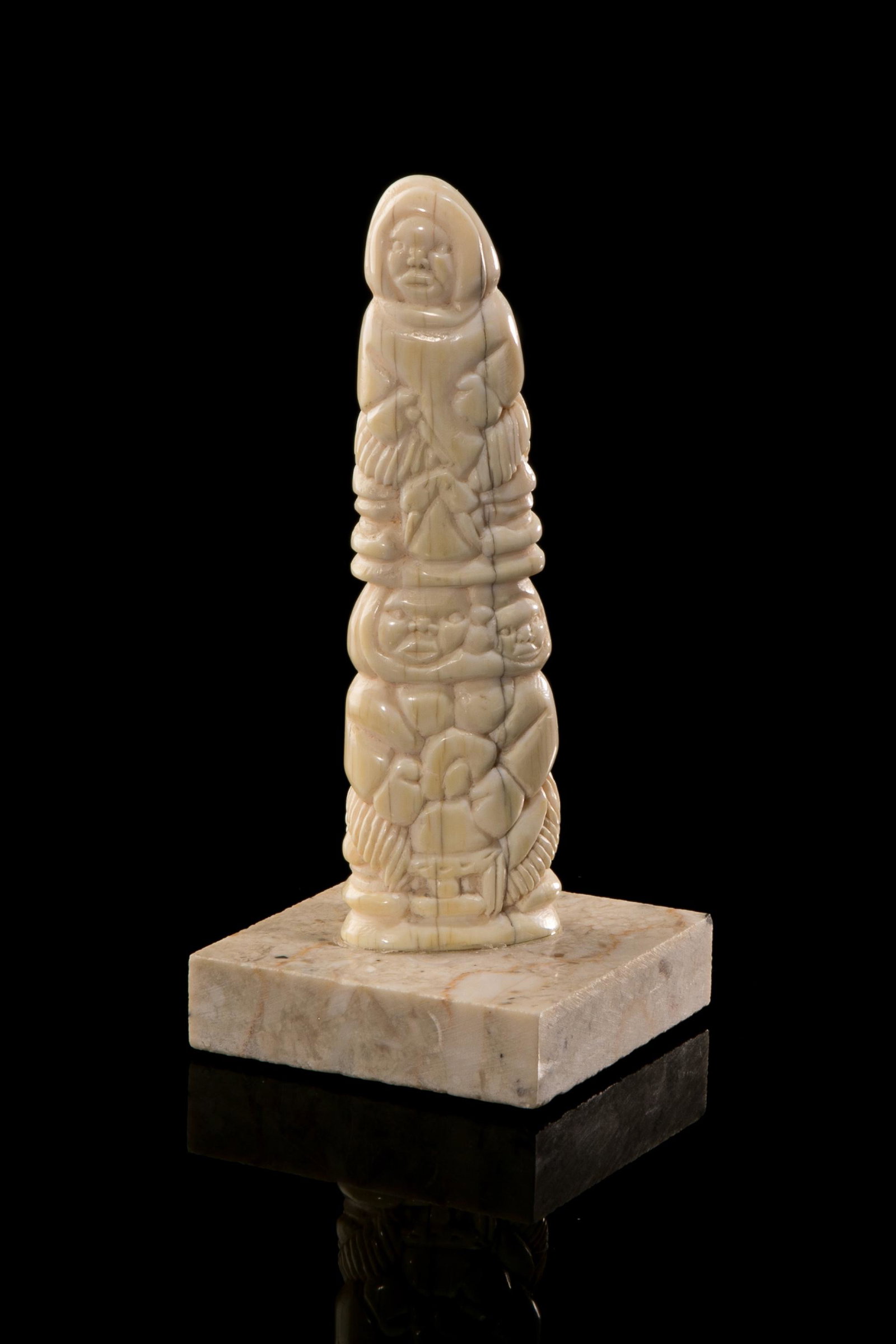 Poss: CHARLIE INUKPUK, INUIT, Totemic Composition with Inuit Hunting, late 1970s: Possibly: CHARLIE INUKPUK (1941-) INUKJUAK (PORT HARRISON) Totemic Composition with Inuit Hunting, late 1970s walrus tusk, 5.75 x 1.75 x 1 in (14.6 x 4.4 x 2.5 cm) unsigned. Provenance Important Priva