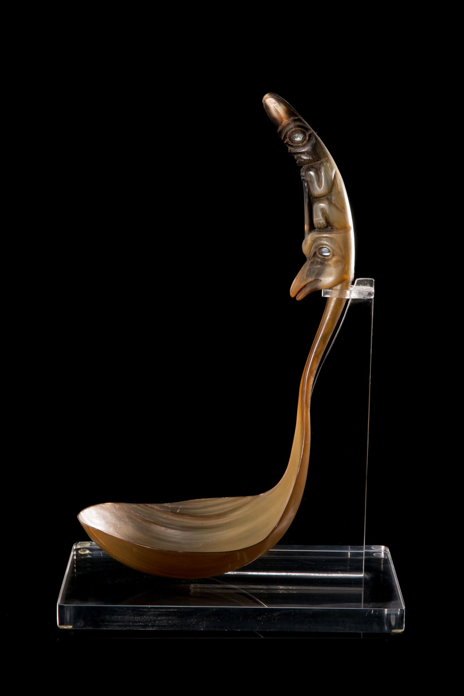 UNIDENTIFIED ARTIST, PROBABLY TLINGIT, Feast Ladle, c. 1900-1910?: UNIDENTIFIED ARTIST, PROBABLY TLINGIT Feast Ladle, c. 1900-1910? horn and abalone, 13 x 7.25 x 5 in (33 x 18.4 x 12.7 cm) unsigned; carved and bent from a single horn; the handle decorated with figure