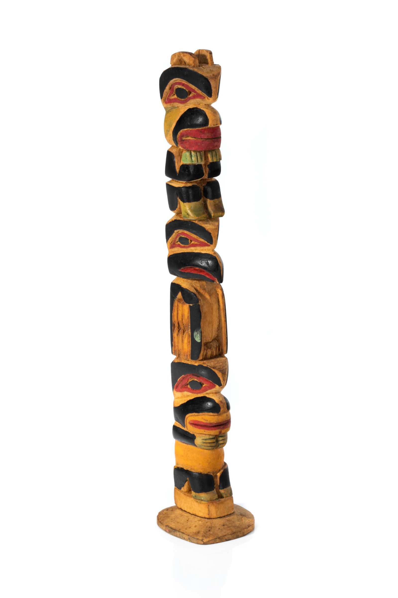 JAMES RUDOLPH (1858-1933) TLINGIT, JUNEAU, ALASKA, Model Totem Pole, c. 1930: JAMES RUDOLPH (1858-1933) TLINGIT, JUNEAU, ALASKA Model Totem Pole, c. 1930 cedar and pigment, 10 x 2 x 1.75 in (25.4 x 5.1 x 4.4 cm) inscribed in graphite in an unknown hand, "cme [?]/ [$]3.00". Prov