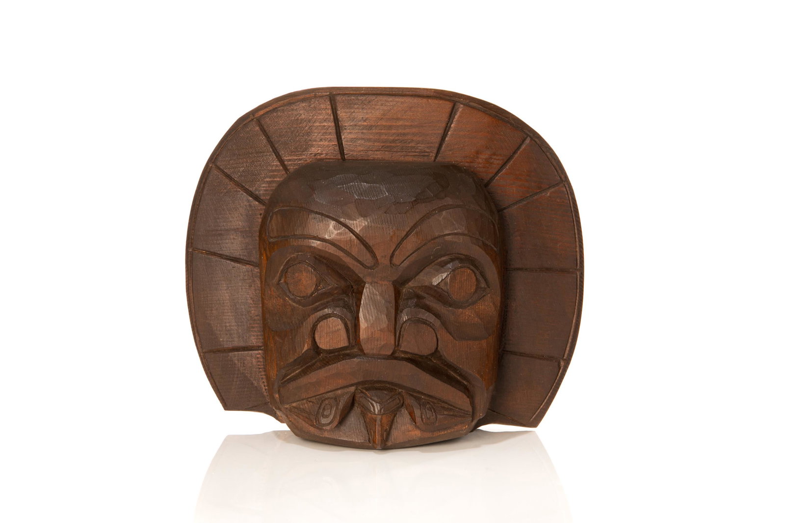 ELLEN NEEL (1916-1966) KWAKWA̱KA̱ʼWAKW, Sun Mask with Raven in Mouth,: ELLEN NEEL (1916-1966) KWAKWA̱KA̱ʼWAKW Sun Mask with Raven in Mouth carved wood, 7.5 x 9 x 2.75 in (19.1 x 22.9 x 7 cm) titled and signed, "Sun Mask with / Raven in Mouth. / Ellen Neel"
