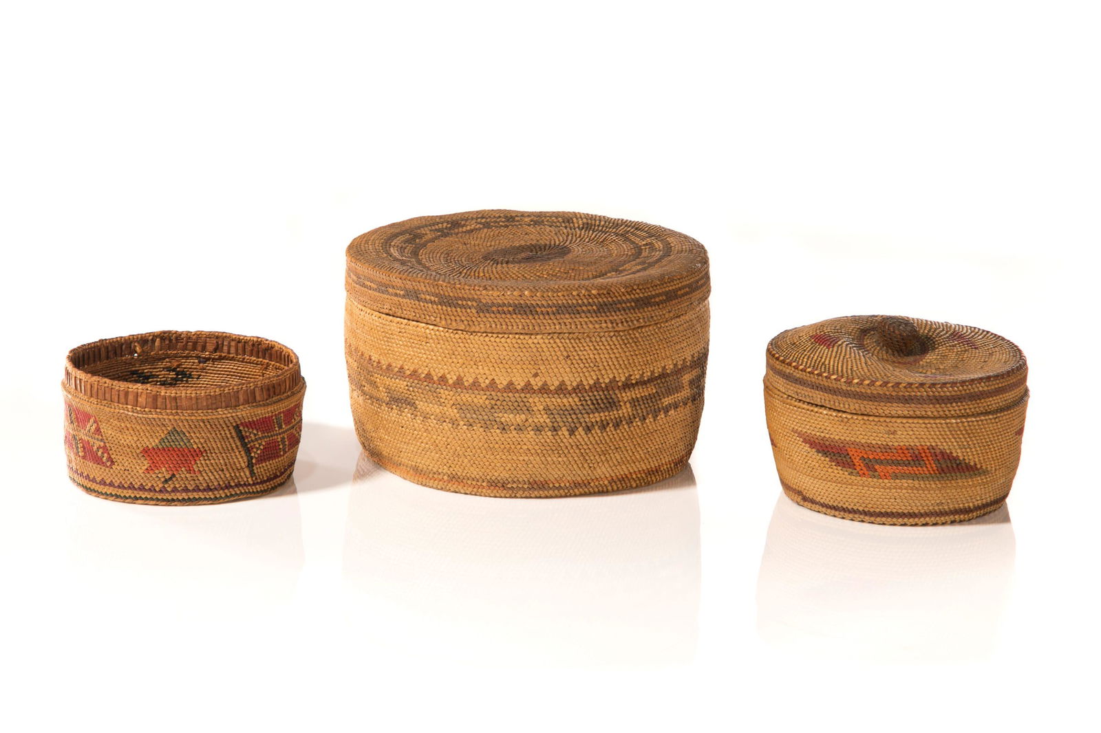 UNIDENTIFIED NUU-CHAH-NULTH ARTISTS, Three Baskets, c. 1870 / 1890: UNIDENTIFIED NUU-CHAH-NULTH ARTISTS Three Baskets, c. 1870 / 1890 each natural and dyed grass, and cedar, largest: 3.5 x 5.75 x 5.75 in (8.9 x 14.6 x 14.6 cm) and smaller Provenance From the Estate of