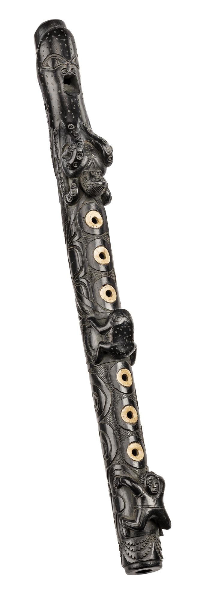 UNIDENTIFIED HAIDA ARTIST, Recorder (Flute), c. 1845-1865: UNIDENTIFIED ARTIST, HAIDA Recorder (Flute), c. 1845-1865 argillite and bone, 2 x 15 x 2 in (5.1 x 38.1 x 5.1 cm) unsigned; affixed to the lower rear side is an old rosette-shaped paper label bearing
