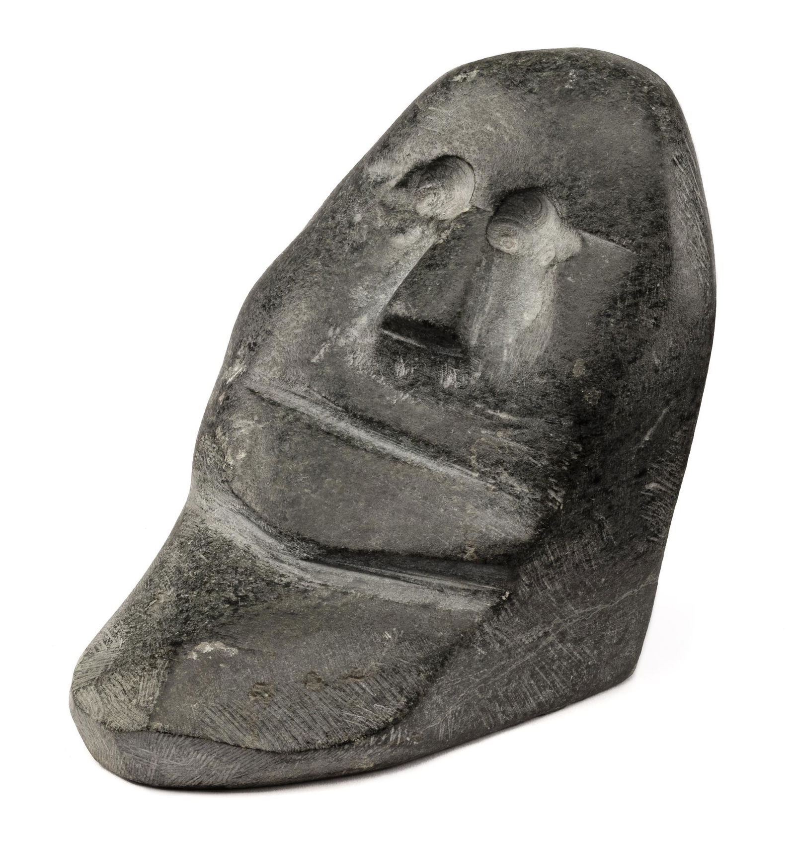 JOHN KAVIK, INUIT, Face, c. 1968-70: JOHN KAVIK (1897-1993) KANGIQLINIQ (RANKIN INLET) Face, c. 1968-70 stone, 4.5 x 4 x 6 in (11.4 x 10.2 x 15.2 cm) signed, “ᑲᕕ”. Provenance Private Collection; Waddington’s