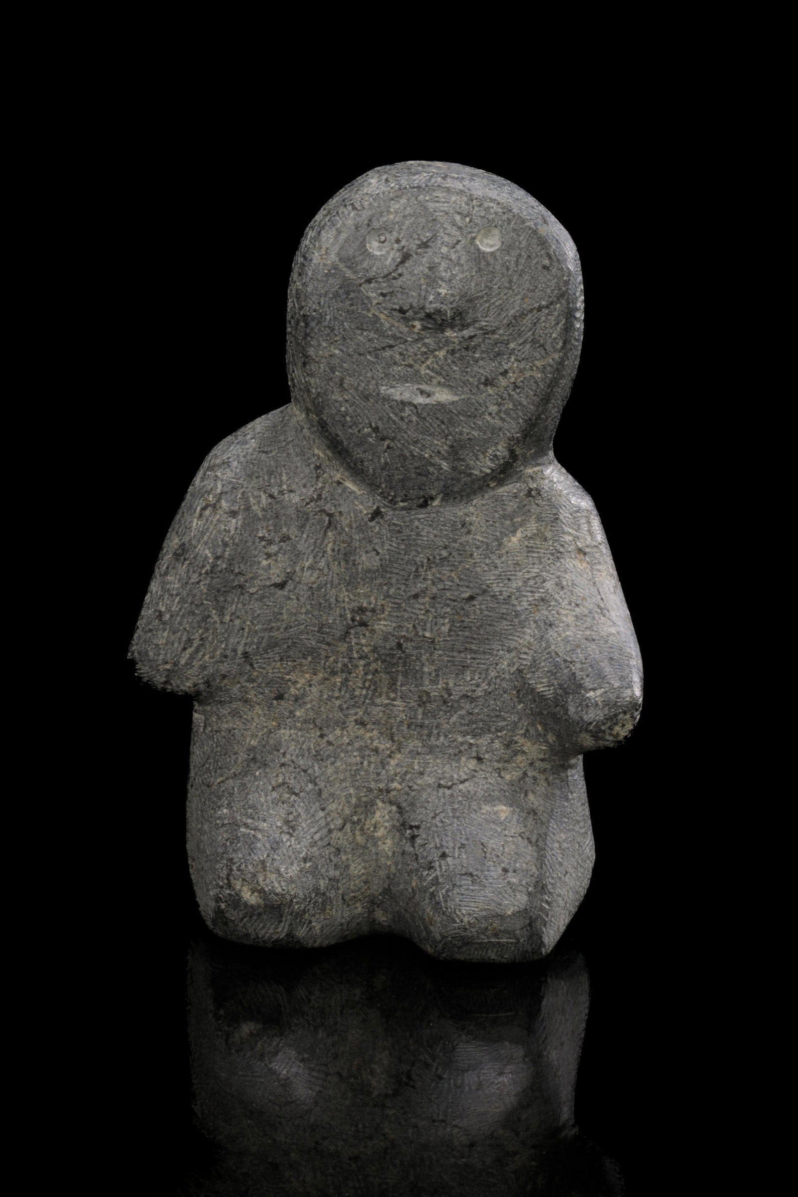 MARC ALIKASWA, INUIT, Kneeling Inuk, late 1980s: MARC ALIKASWA (1928-2008) ARVIAT (ESKIMO POINT) Kneeling Inuk, late 1980s stone, 6.25 x 4.25 x 3 in (15.9 x 10.8 x 7.6 cm) unsigned. Provenance Private Collection, Hamilton, Ont;Bequeathed to the pres