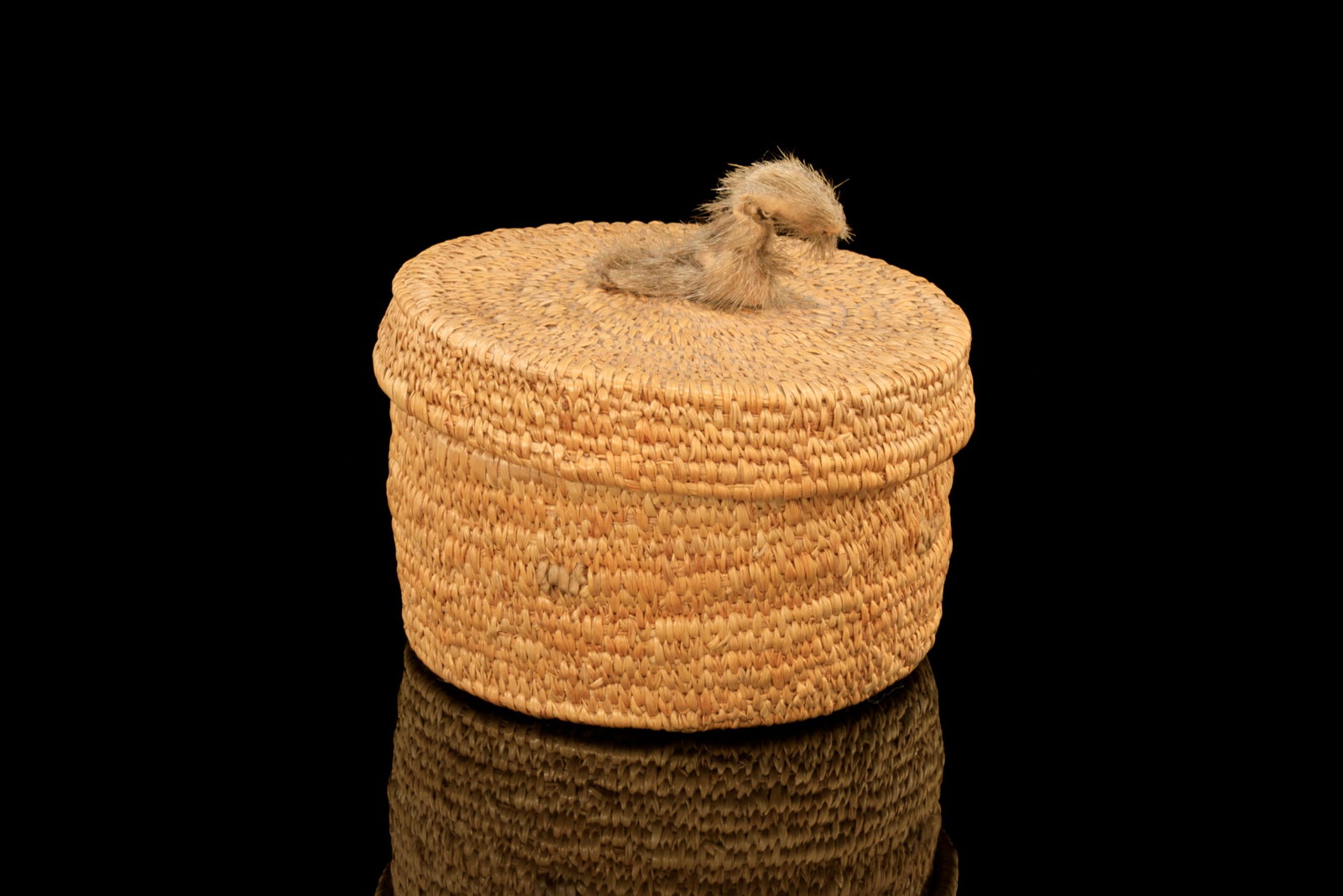 UNIDENTIFIED ARTIST, INUIT, Wove Basket with Animal Knob, c. 1970s: UNIDENTIFIED ARTIST, NUNAVIK (ARCTIC QUEBEC) Wove Basket with Animal Knob, c. 1970s wove lime grass and sealskin, 4.25 x 4.75 x 4.75 in (10.8 x 12.1 x 12.1 cm) unsigned. Provenance Private Collection,