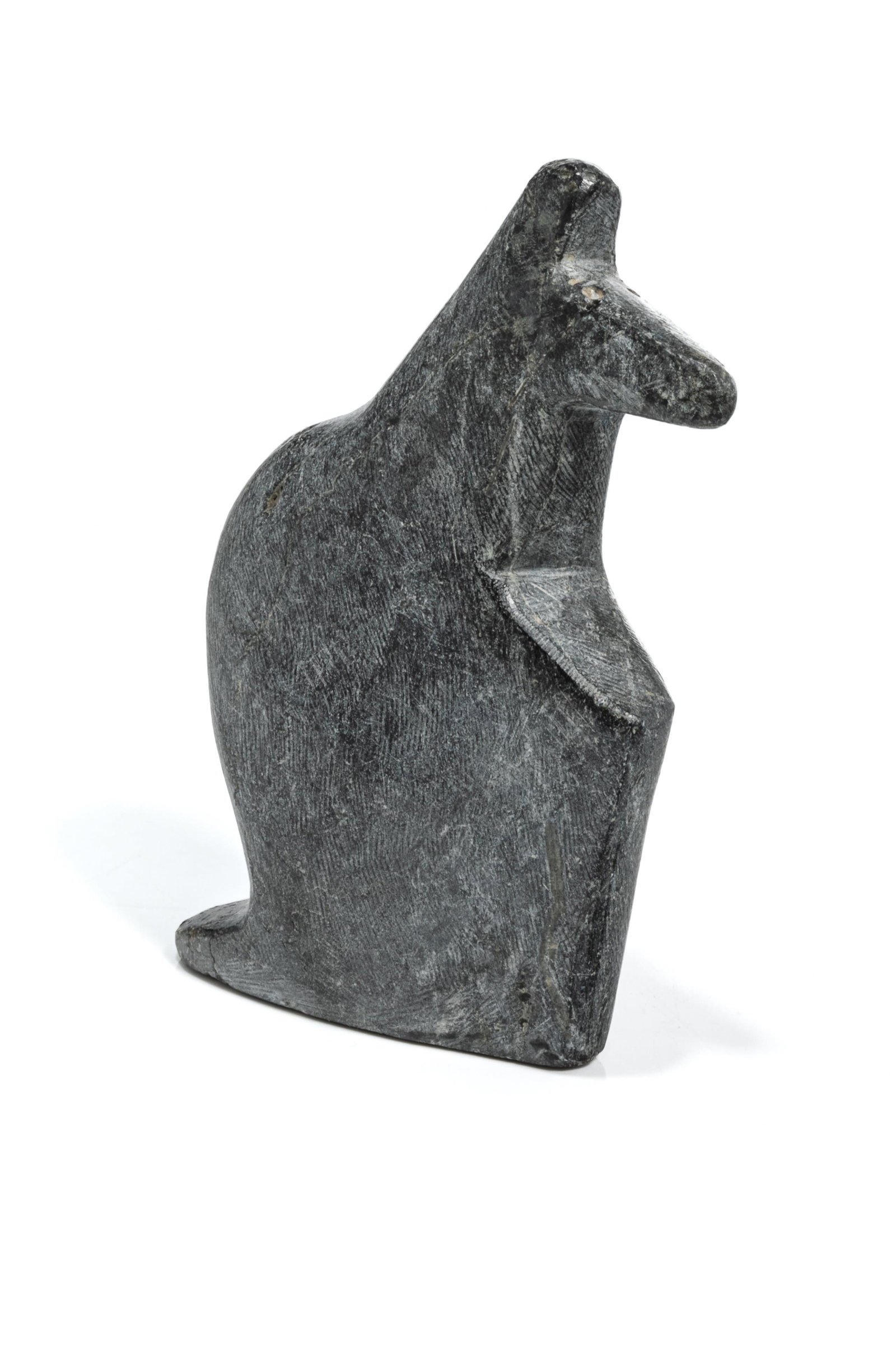 ANDY MIKI, INUIT, Animal, mid 1970s: ANDY MIKI (1918-1983) ARVIAT (ESKIMO POINT) Animal, mid 1970s stone, 4.25 x 2.5 x 0.75 in (10.8 x 6.3 x 1.9 cm) signed, "ᒥᑭ". Provenance Private Collection, California. Animal has th