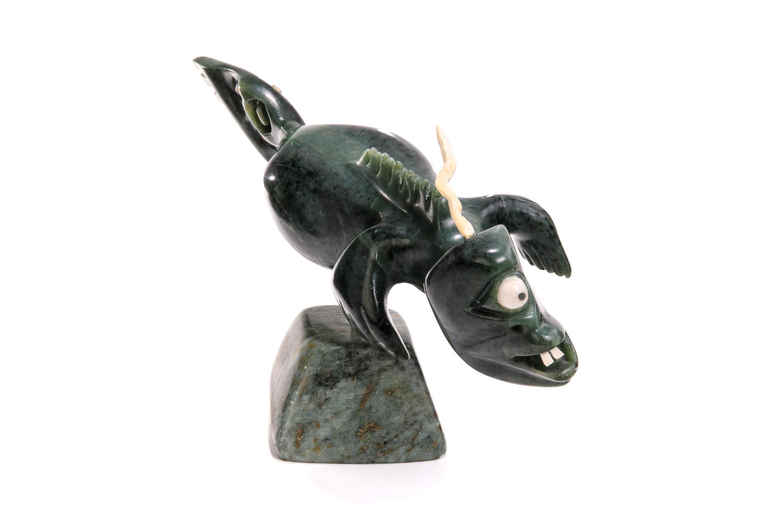 FLOYD KUPTANA, INUIT, Kalupalik [?] (Swimming Sea Spirit), 2001: FLOYD KUPTANA (1964-2021) PAULATUK Kalupalik [?] (Swimming Sea Spirit), 2001 stone, antler, and red inlay, 8.25 x 15.5 x 4.5 in (21 x 39.4 x 11.4 cm) signed, titled, inscribed, and dated, "Floyd Kupta